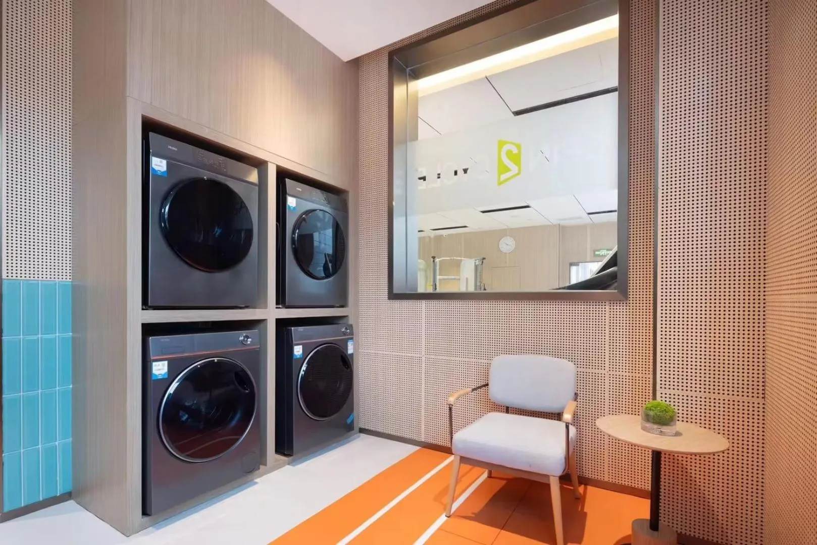washing machine in Home2 Suite by Meishan Dongpo