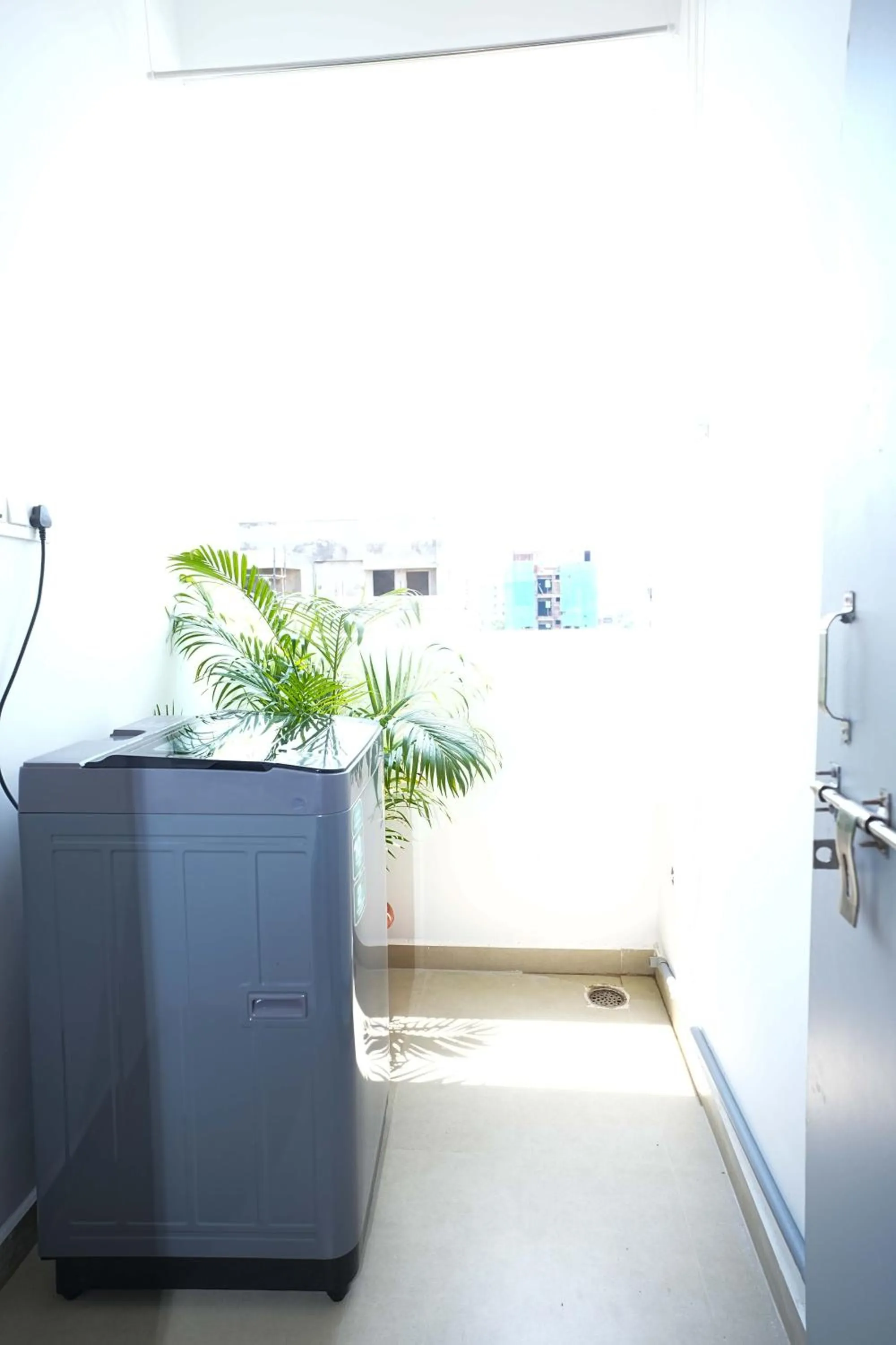 washing machine in Yellow Bells Studios And Suites