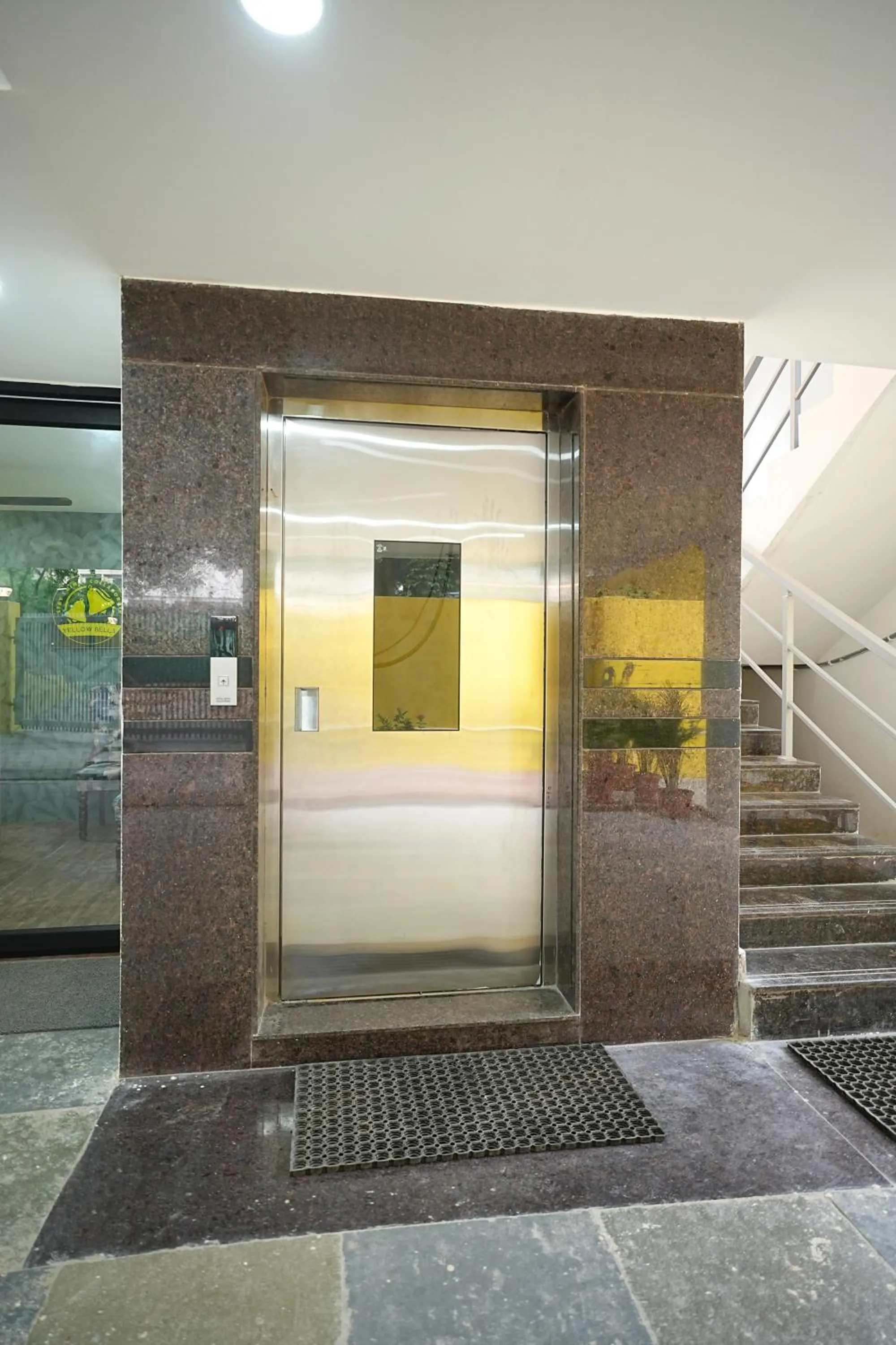 elevator in Yellow Bells Studios And Suites
