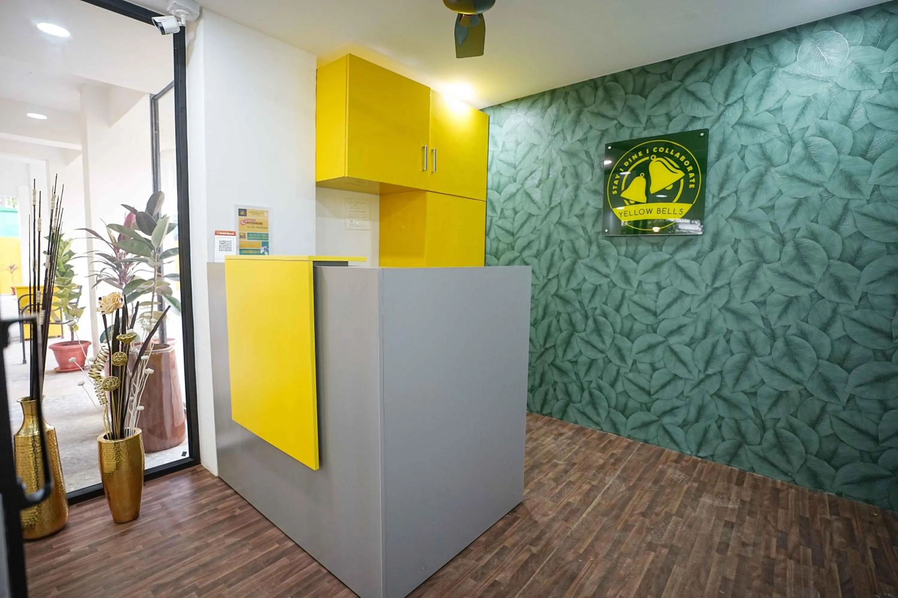 Property logo or sign in Yellow Bells Studios And Suites