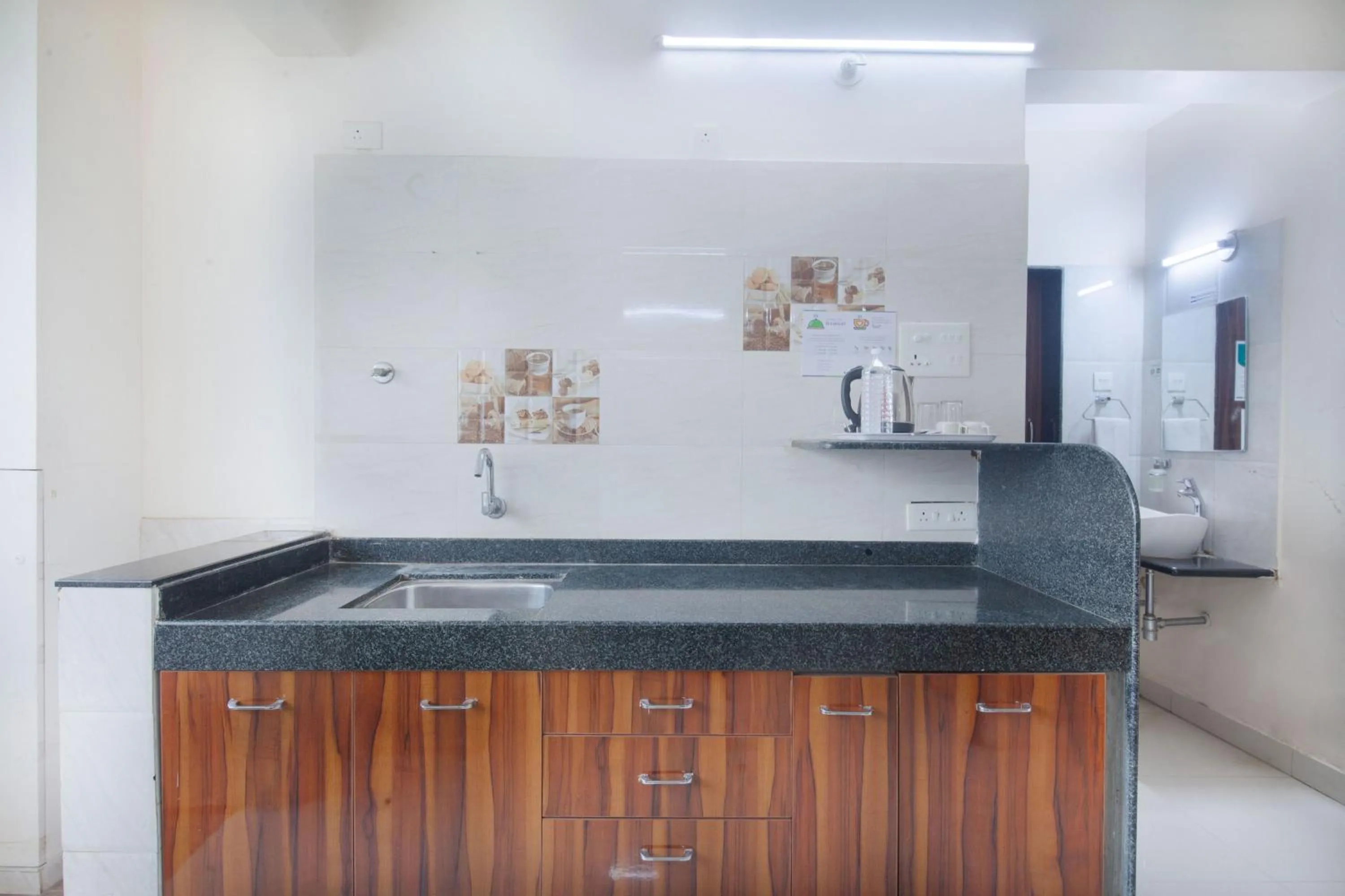 Kitchen or kitchenette in Treebo Park View Hadapsar