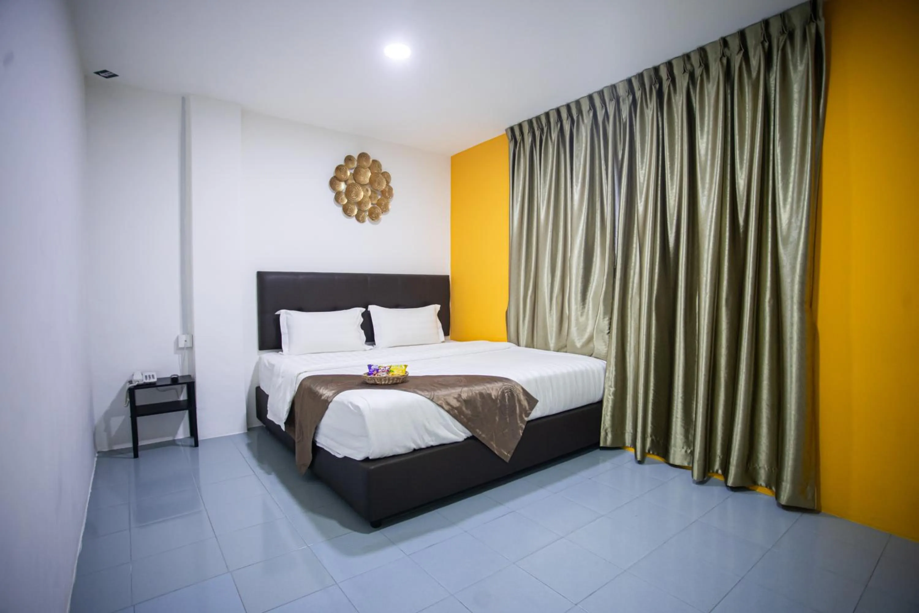 Bed in Rex City Hotel