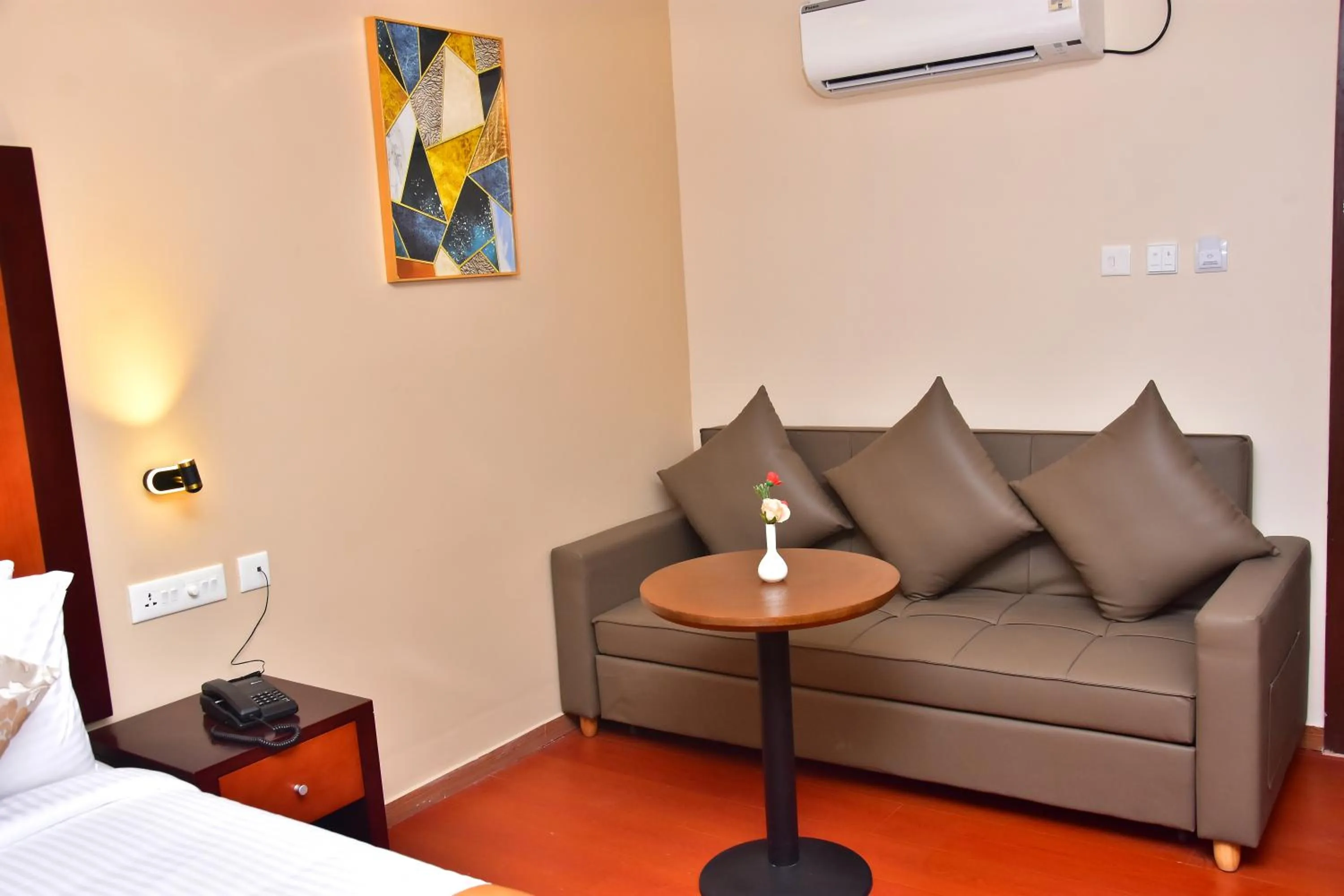 Seating area, Bed in Park Avenue Hotel & Apartments Trichy