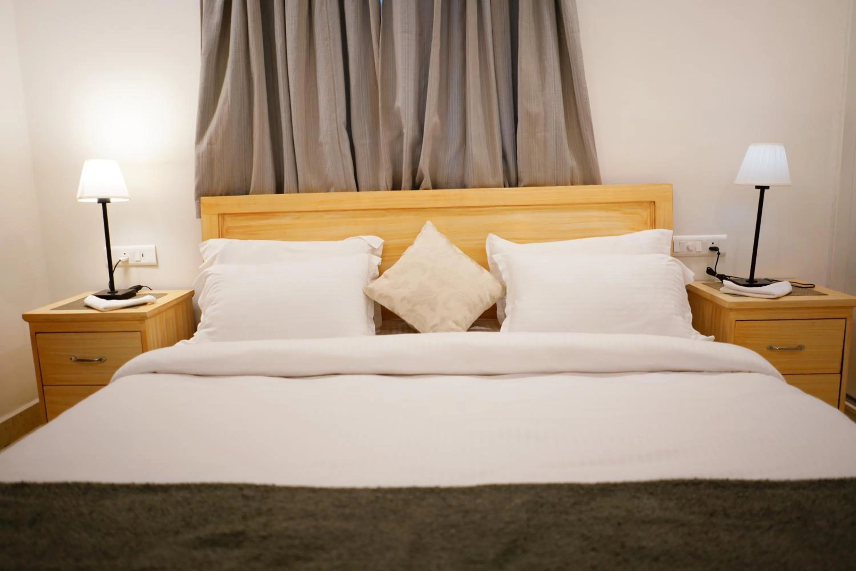 Bed in Enkay Service Apartments