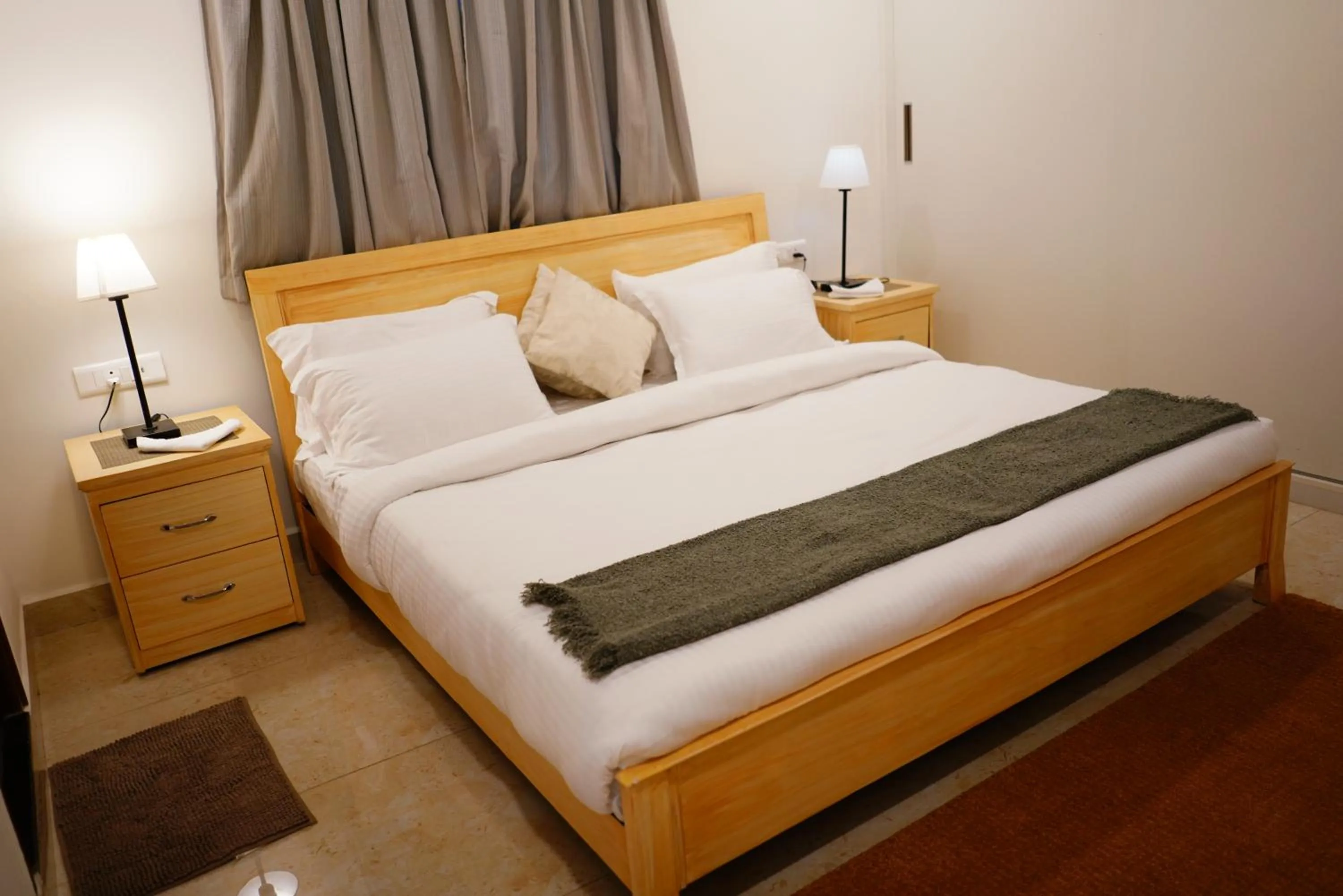 Bed in Enkay Service Apartments