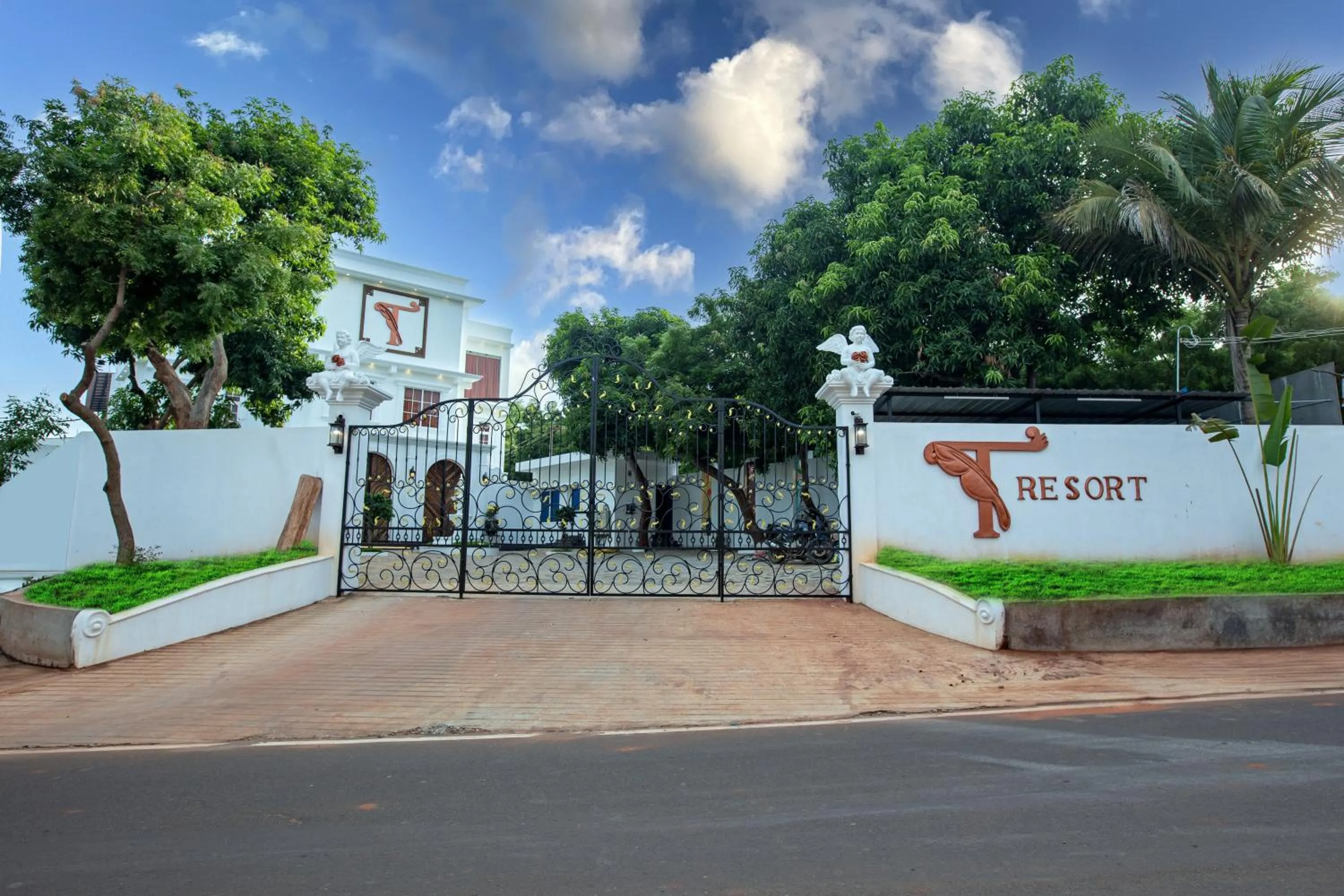 Property logo or sign in T Resort with Swimming Pool