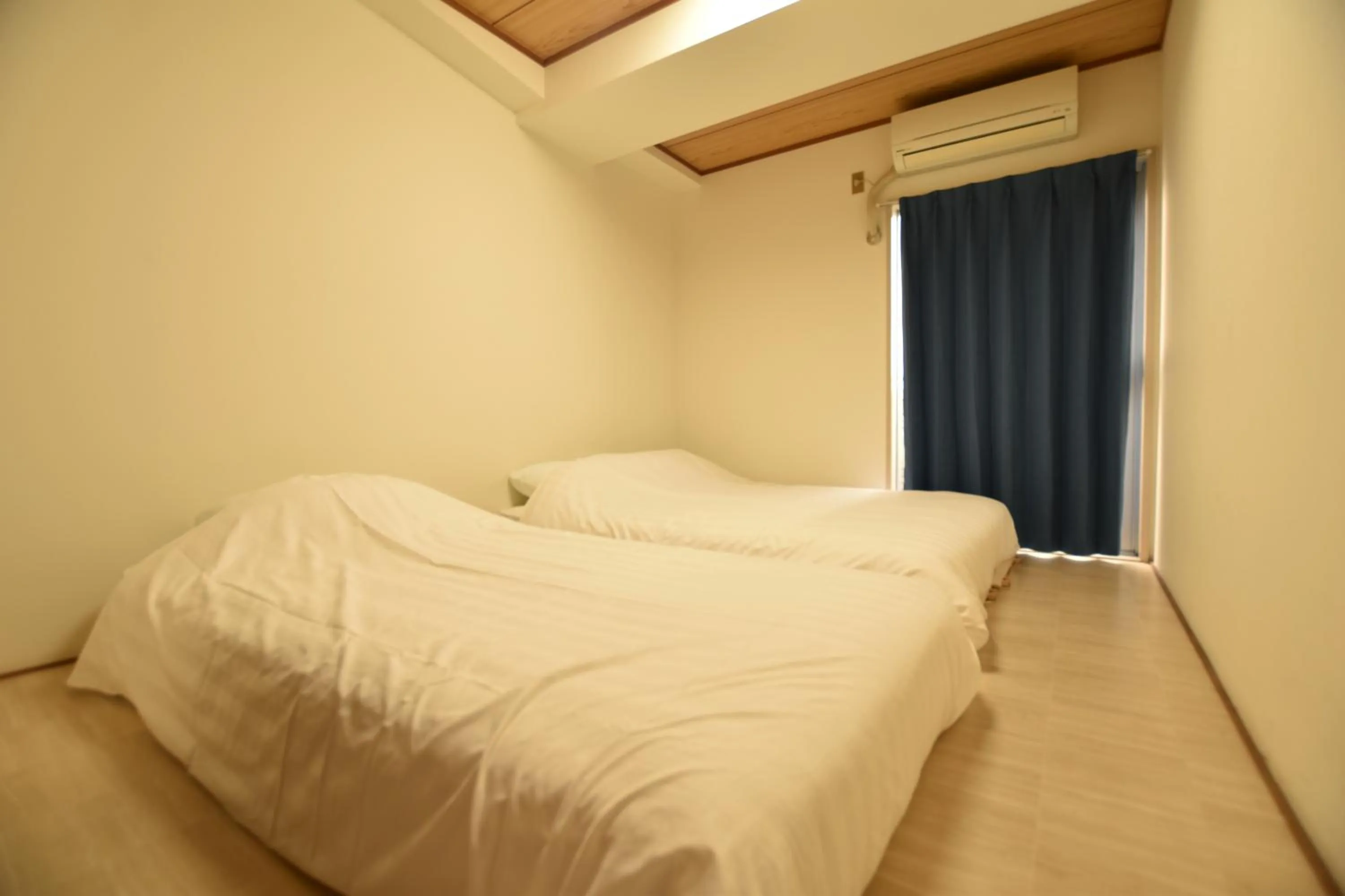 Bed in Randor Residence Tokyo Grand