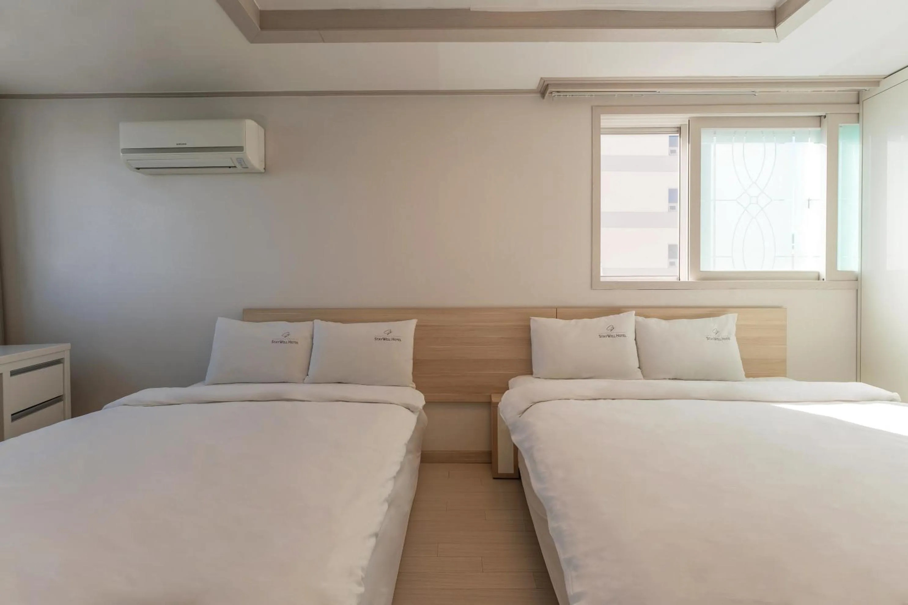 Bed in Staywell Hotel