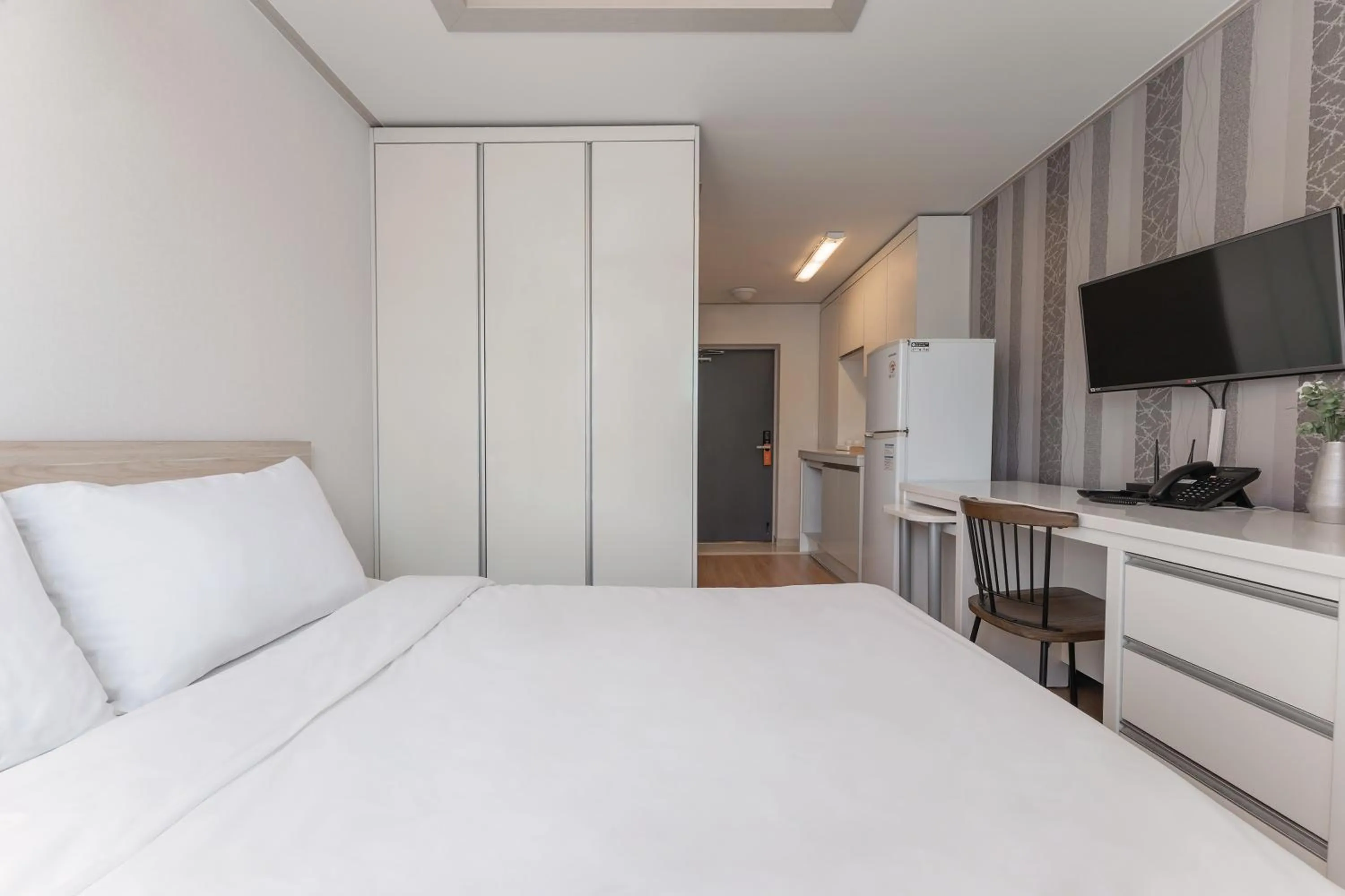 Bed in Staywell Hotel