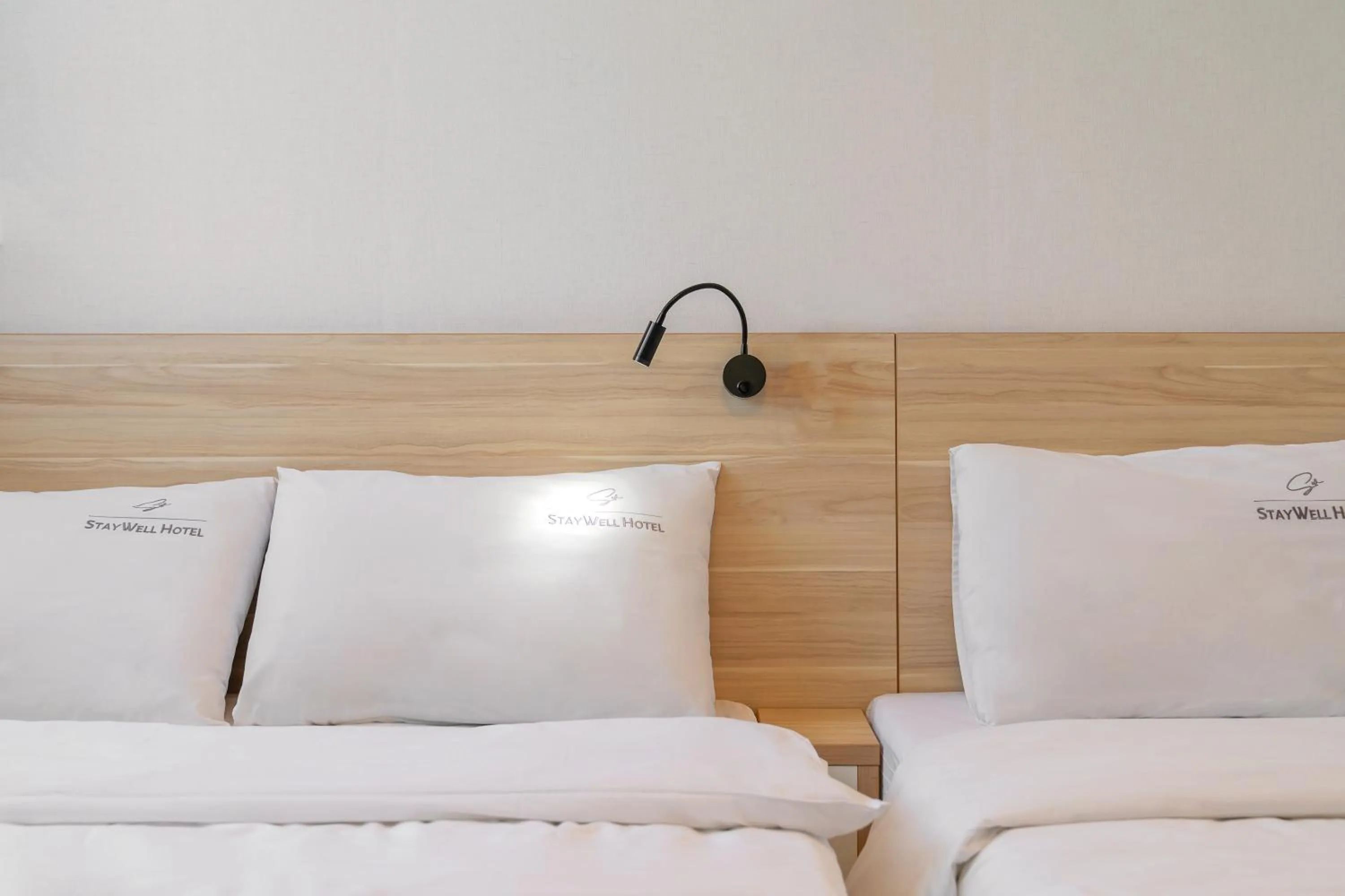 Bed in Staywell Hotel