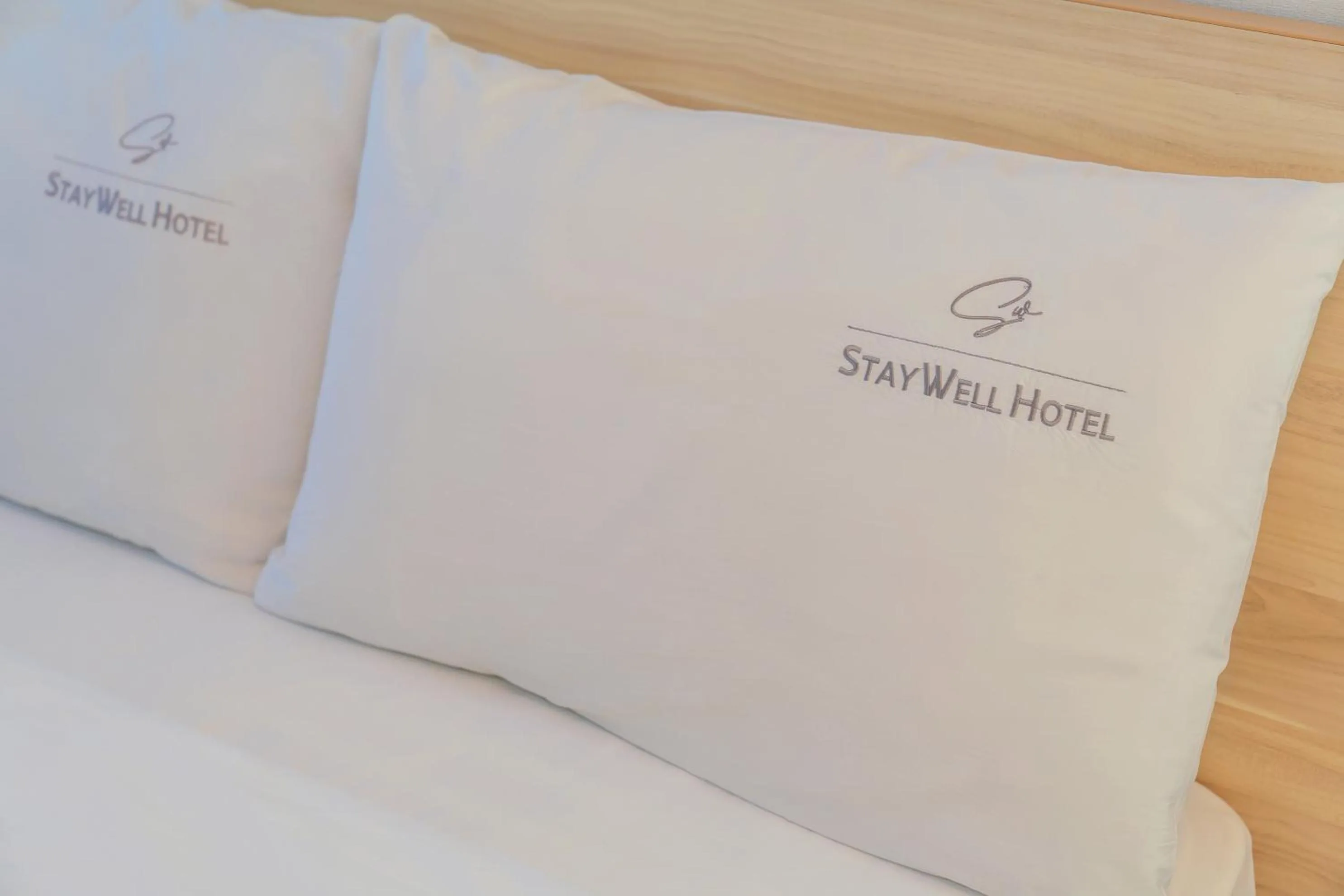 Bed in Staywell Hotel