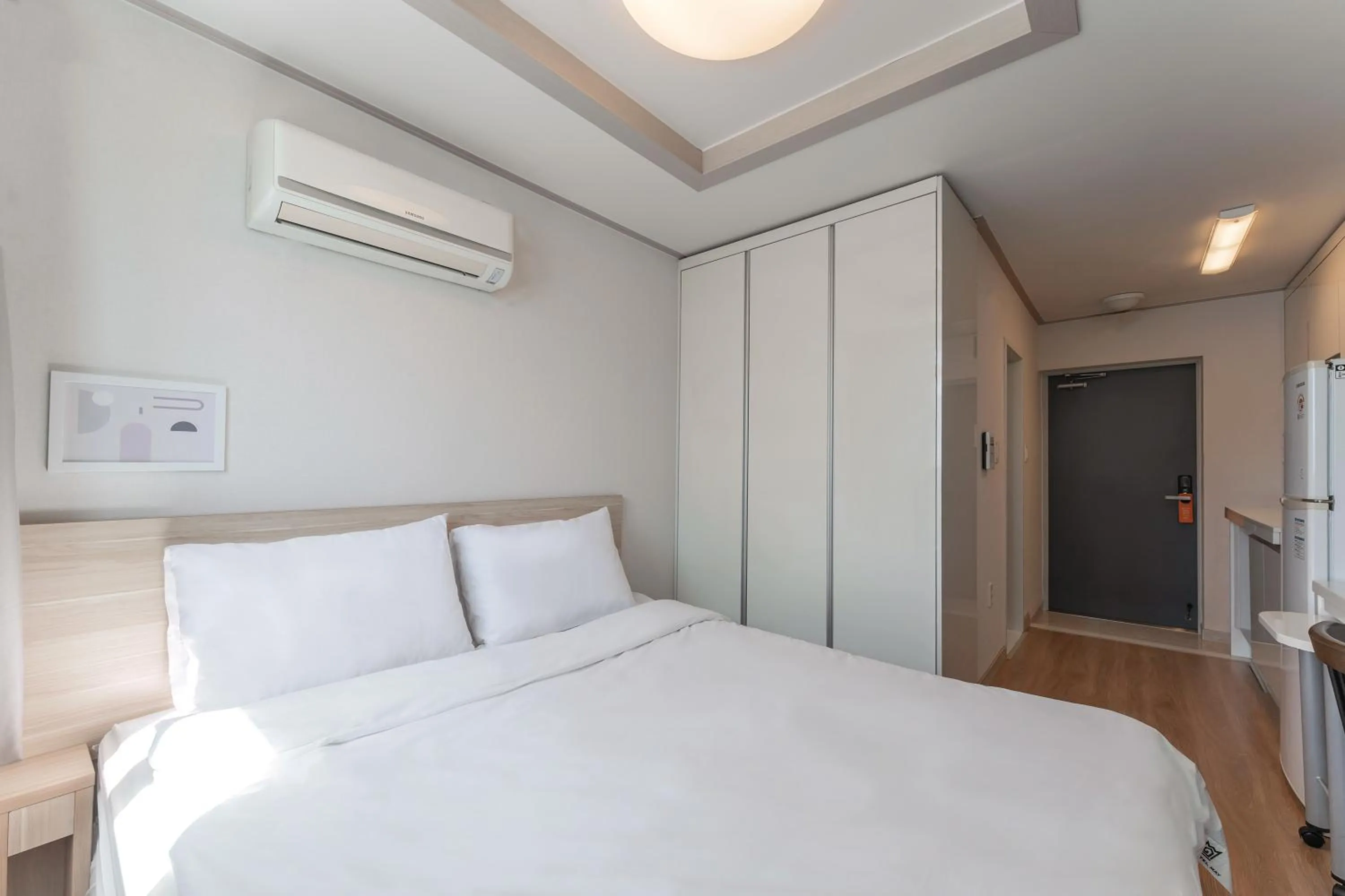 Bed in Staywell Hotel