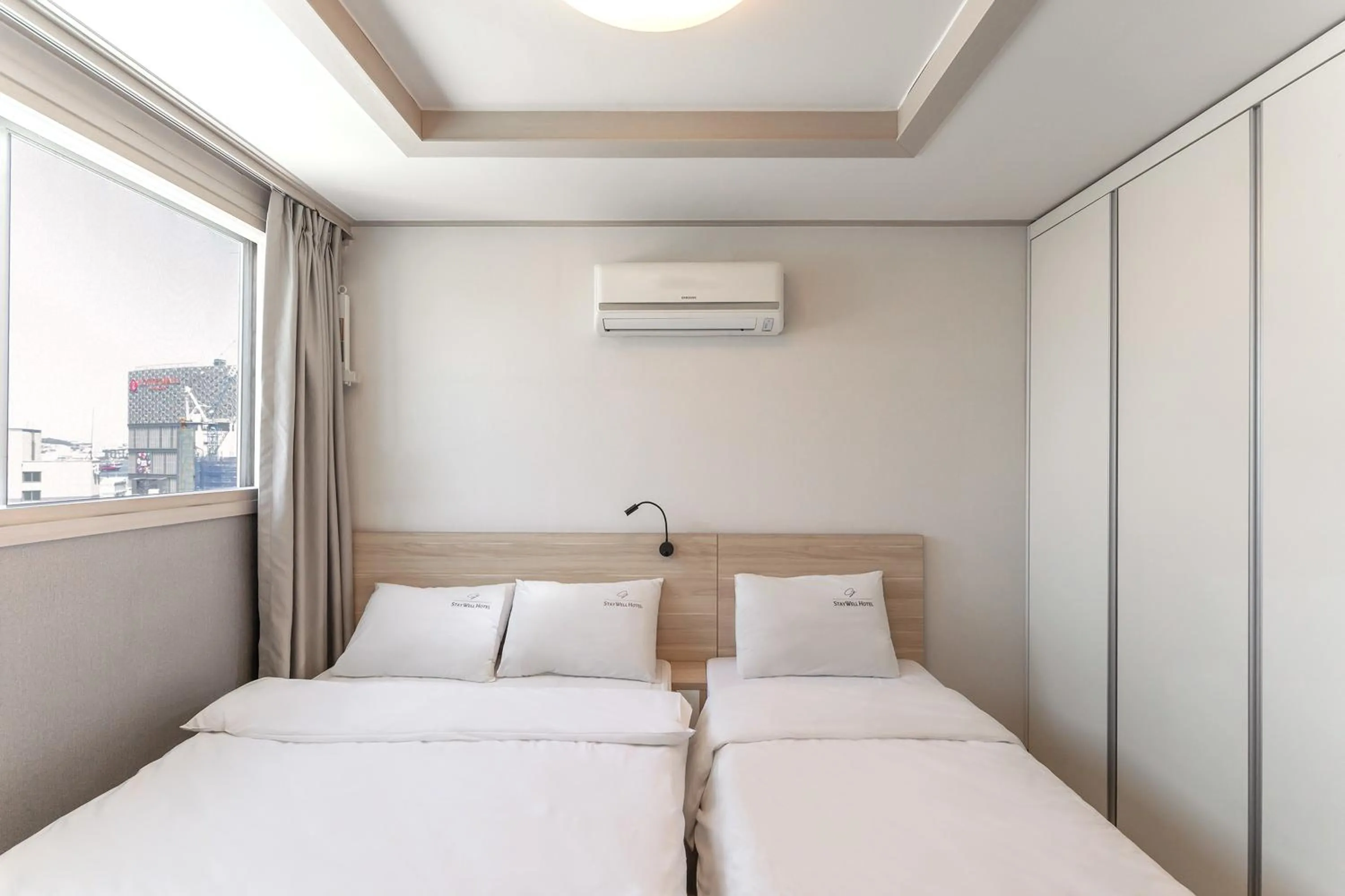 Bed in Staywell Hotel