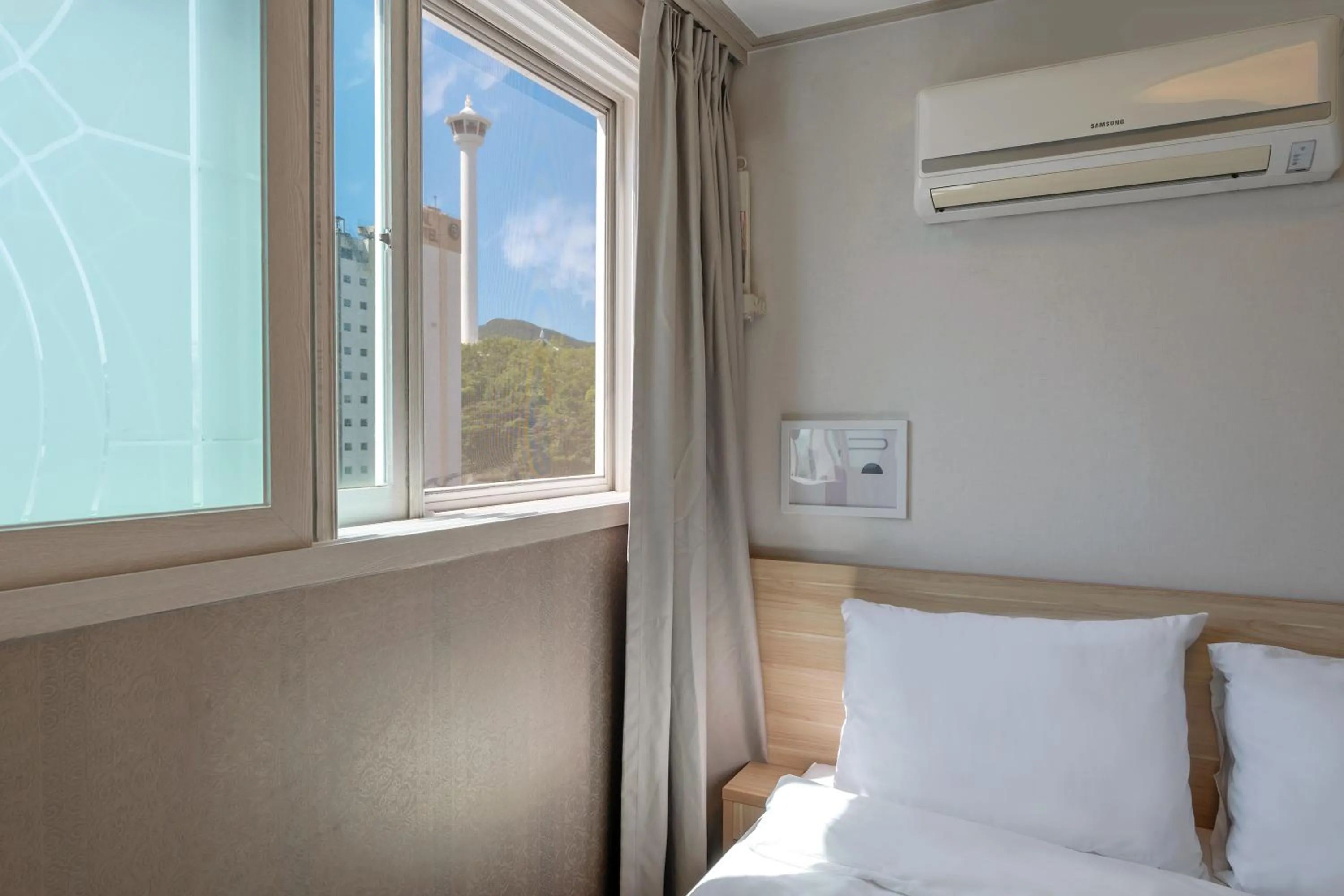 Bed in Staywell Hotel