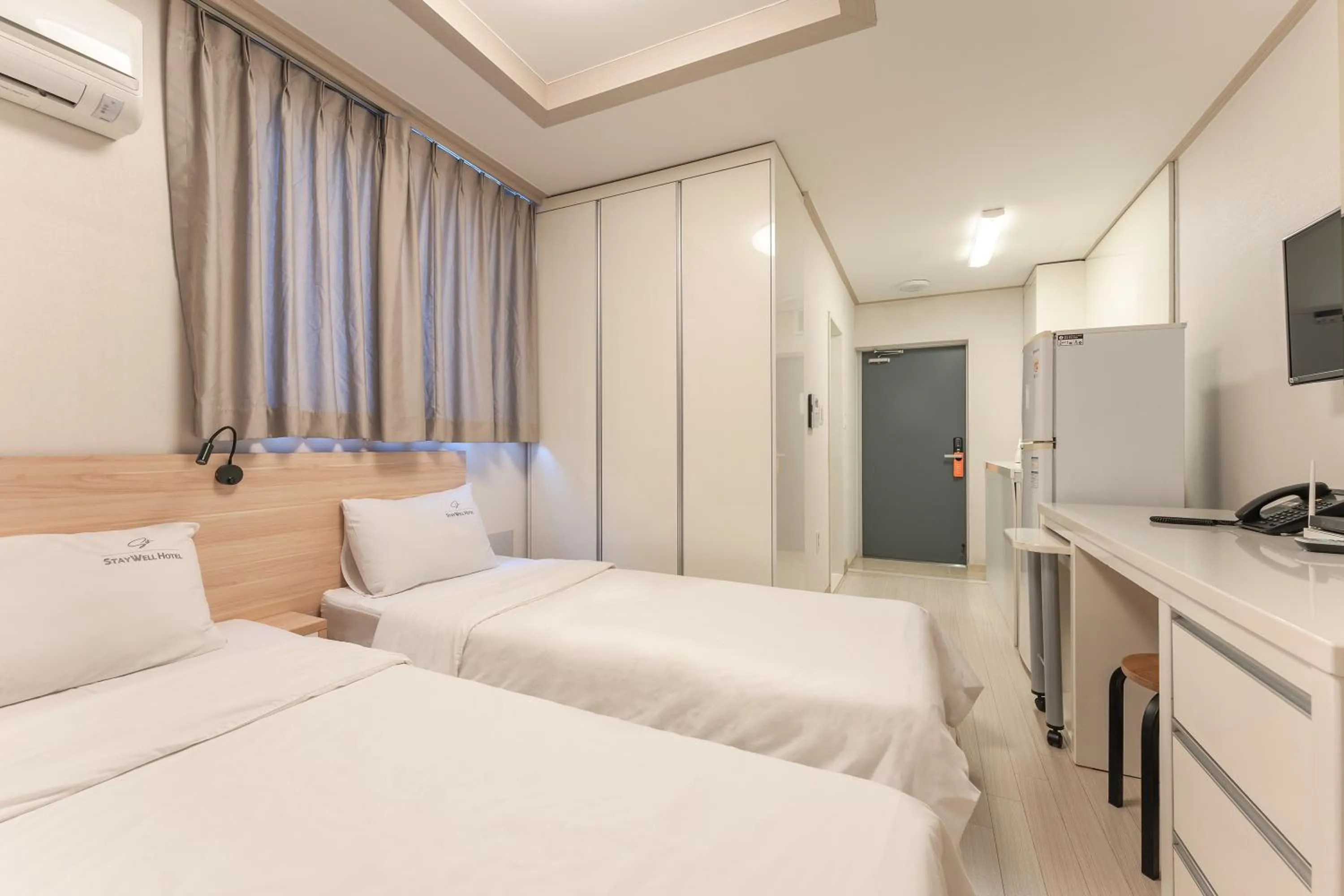 Bed in Staywell Hotel