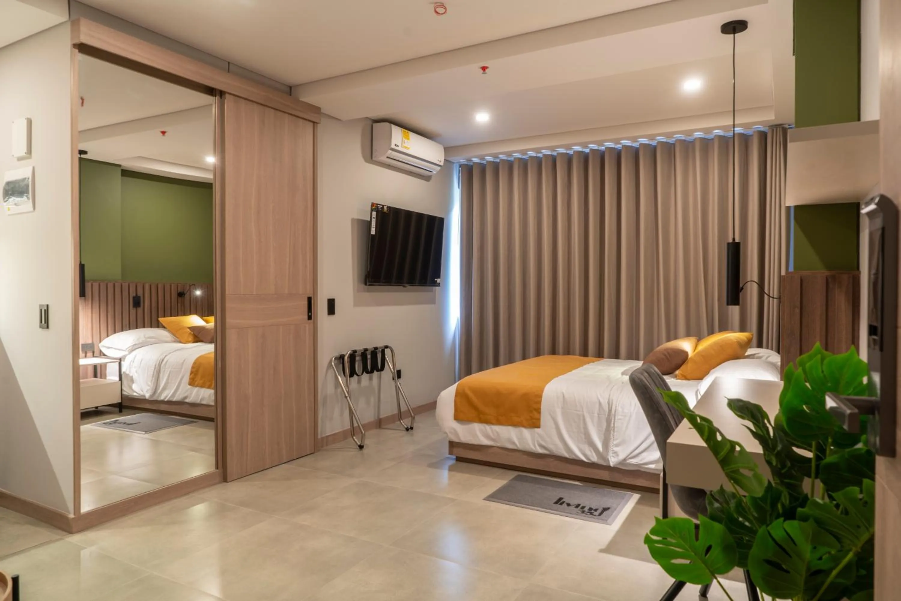 TV and multimedia, Bed in Hotel Living 35 Suites by Growing Group