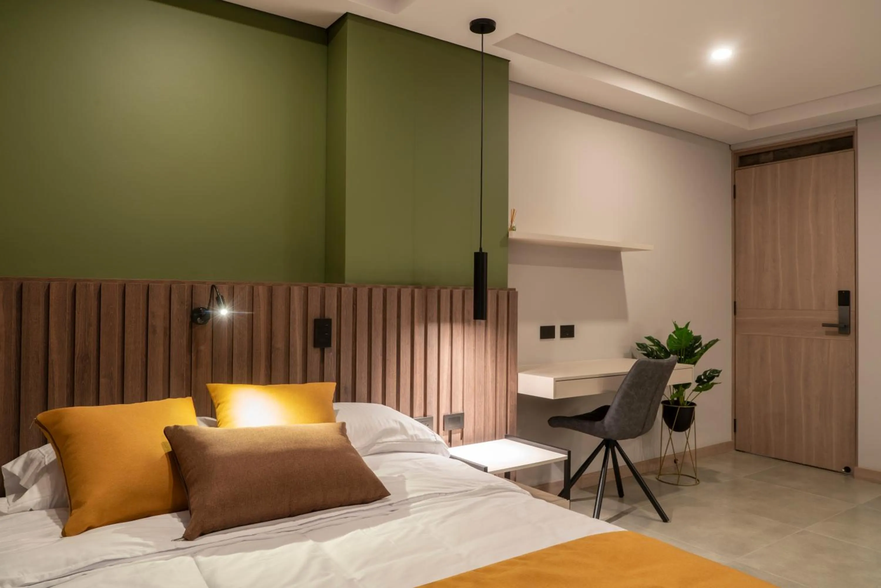 Bed in Hotel Living 35 Suites by Growing Group