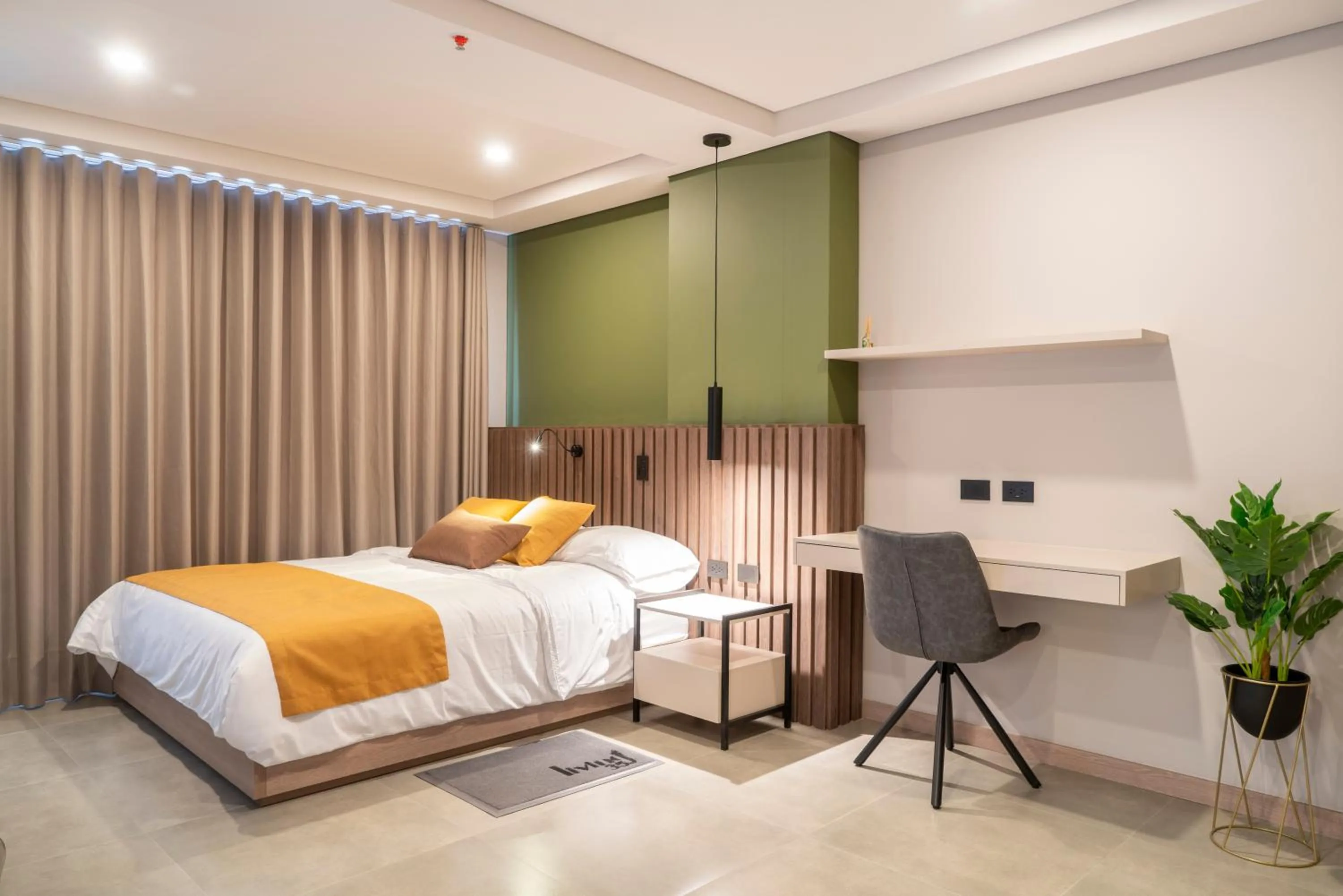 Bed in Hotel Living 35 Suites by Growing Group