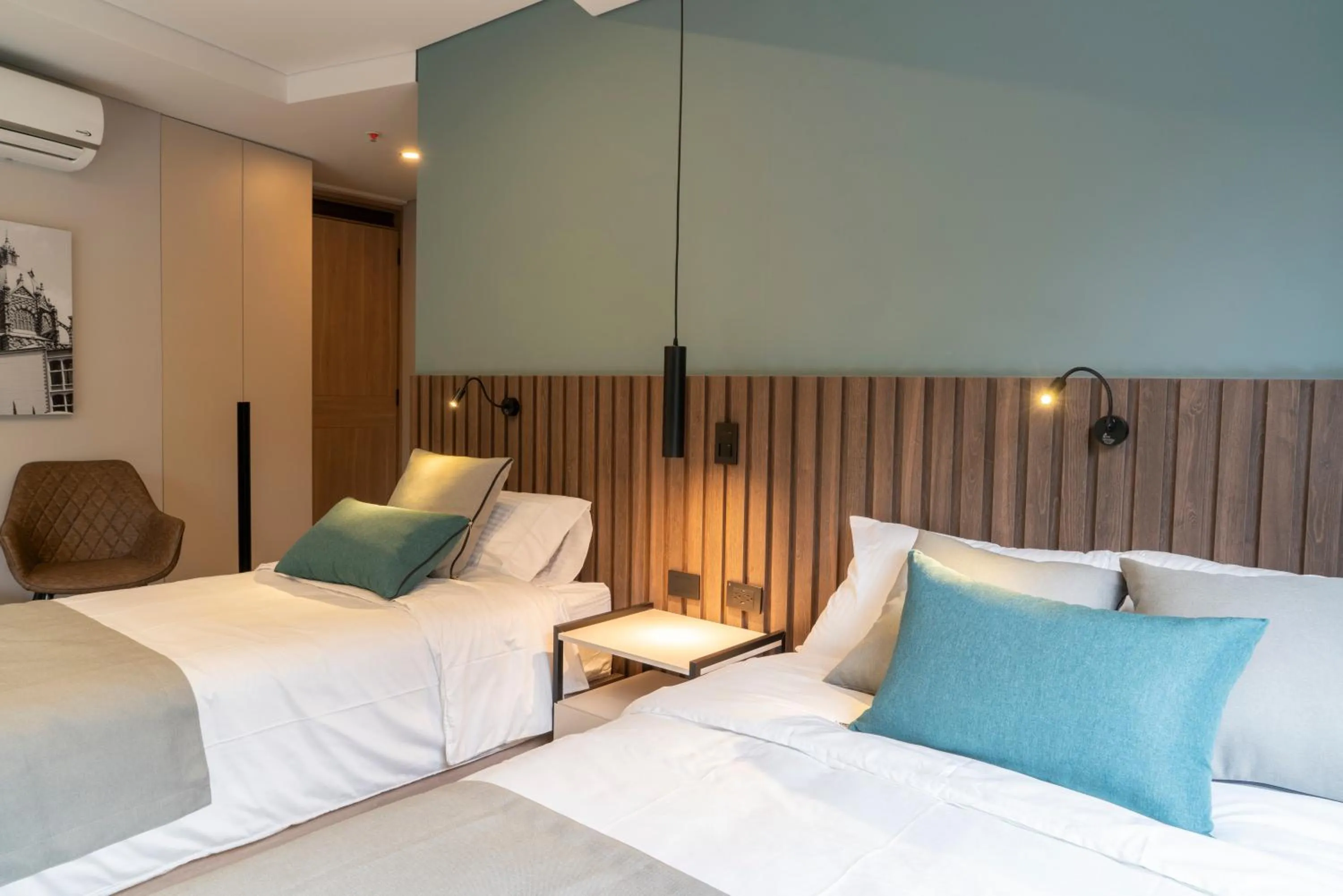 Bed in Hotel Living 35 Suites by Growing Group