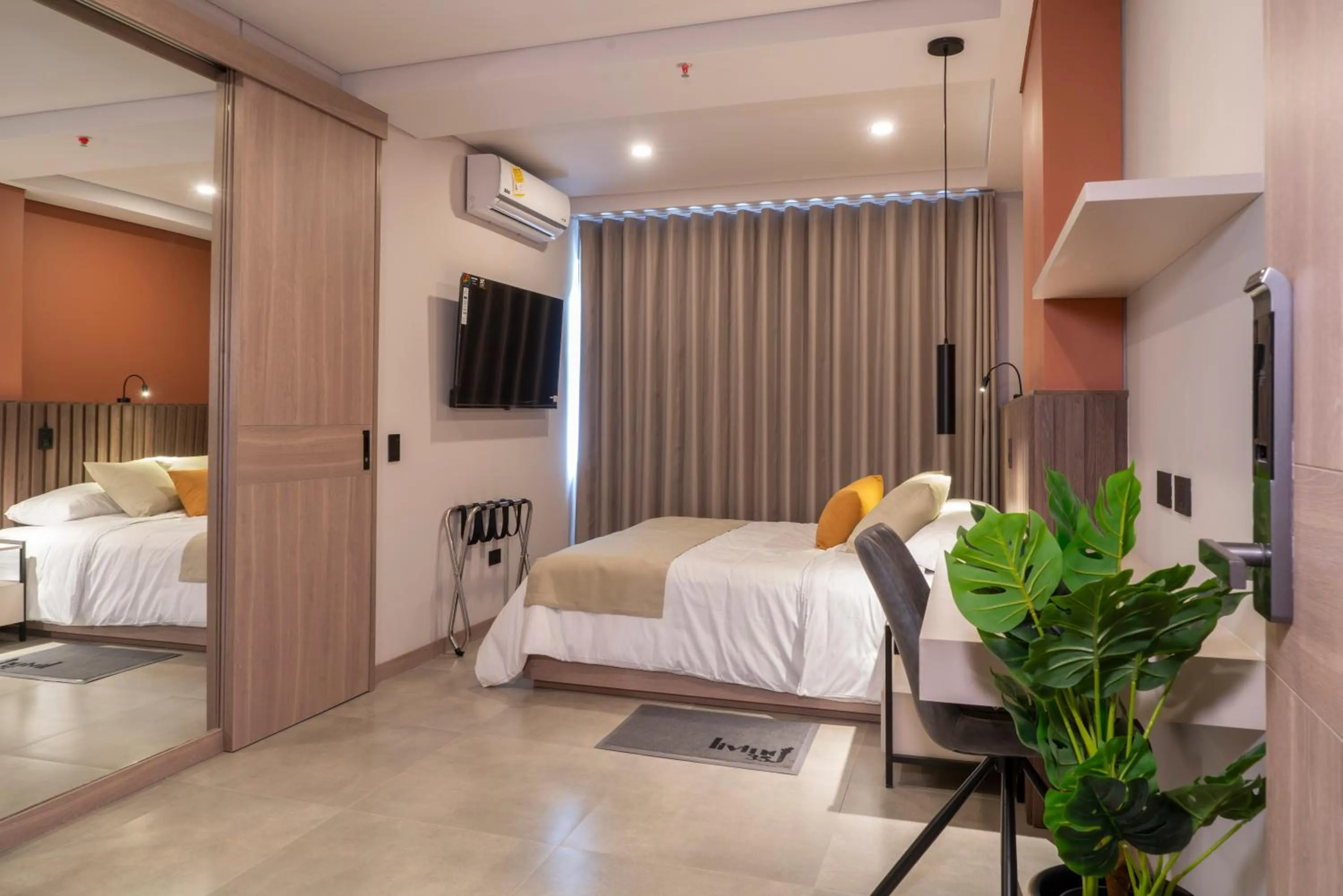 Bed in Hotel Living 35 Suites by Growing Group