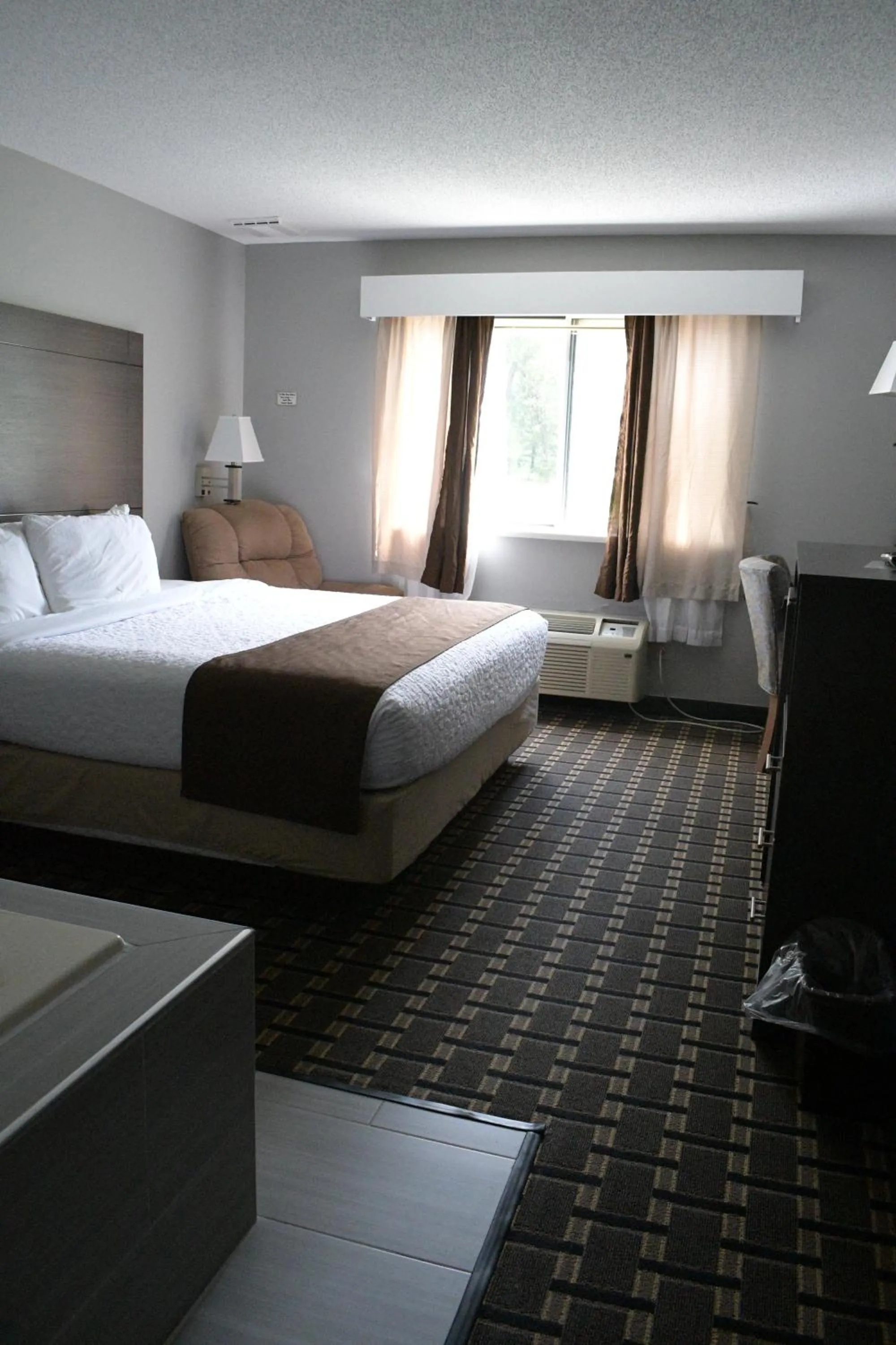 Bed in Adams Inn and Suites