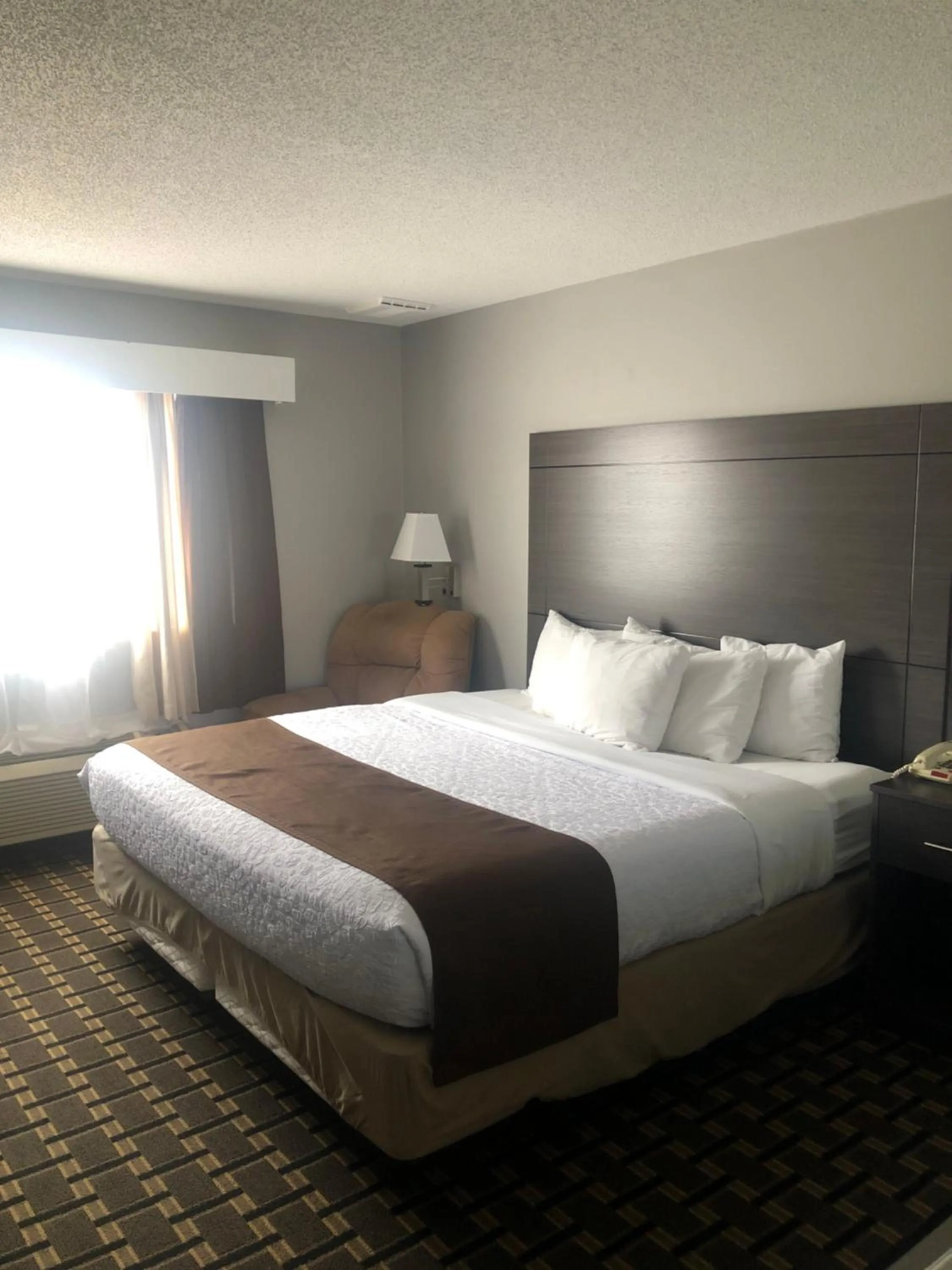 Bed in Adams Inn and Suites