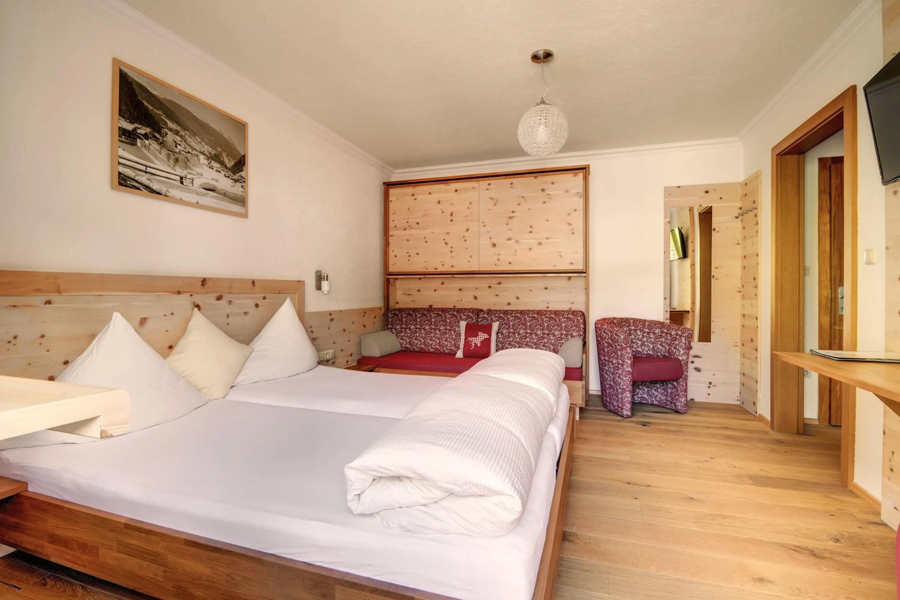 Photo of the whole room, Bed in Hotel Enzian Paznaun