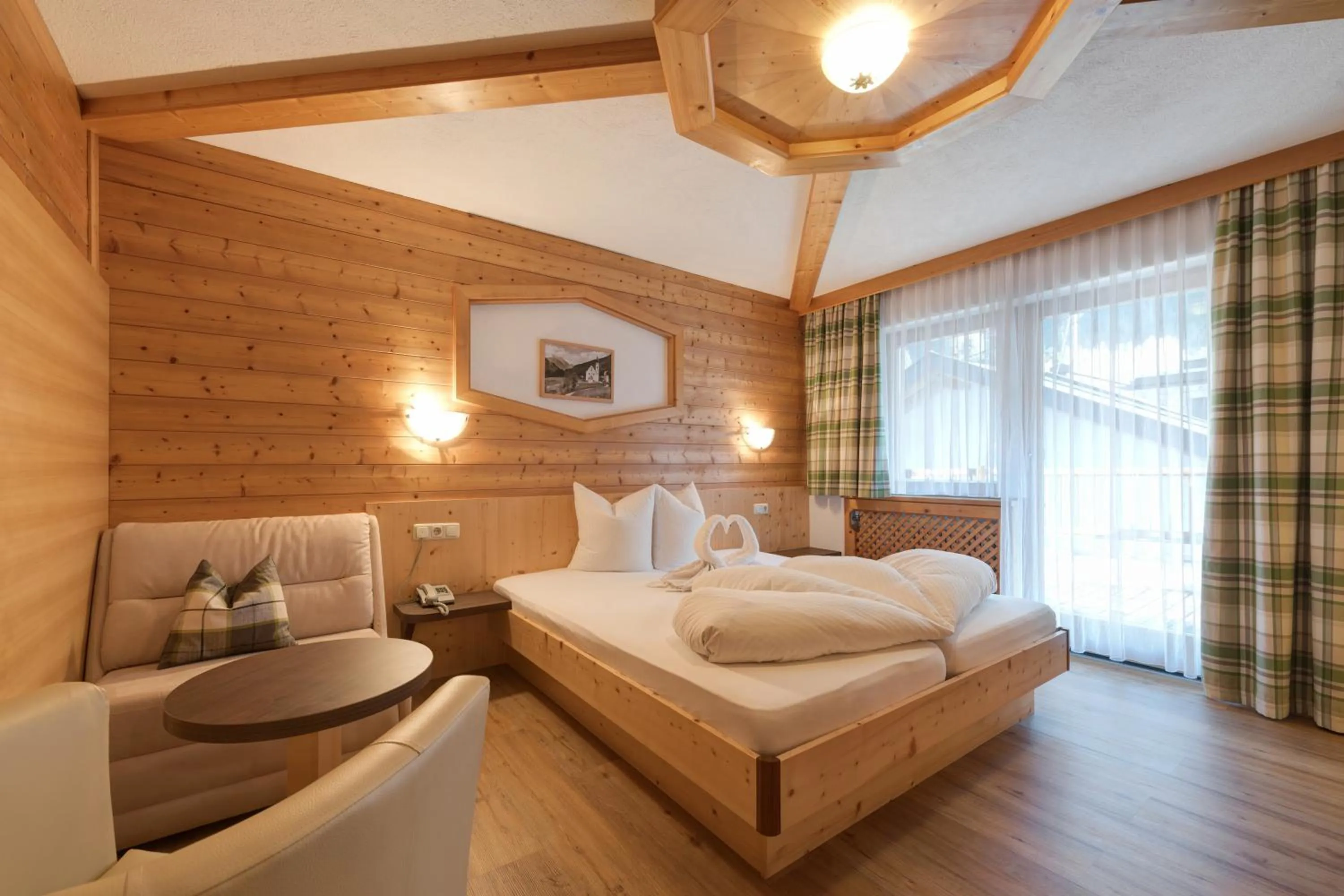 Photo of the whole room, Bed in Hotel Enzian Paznaun