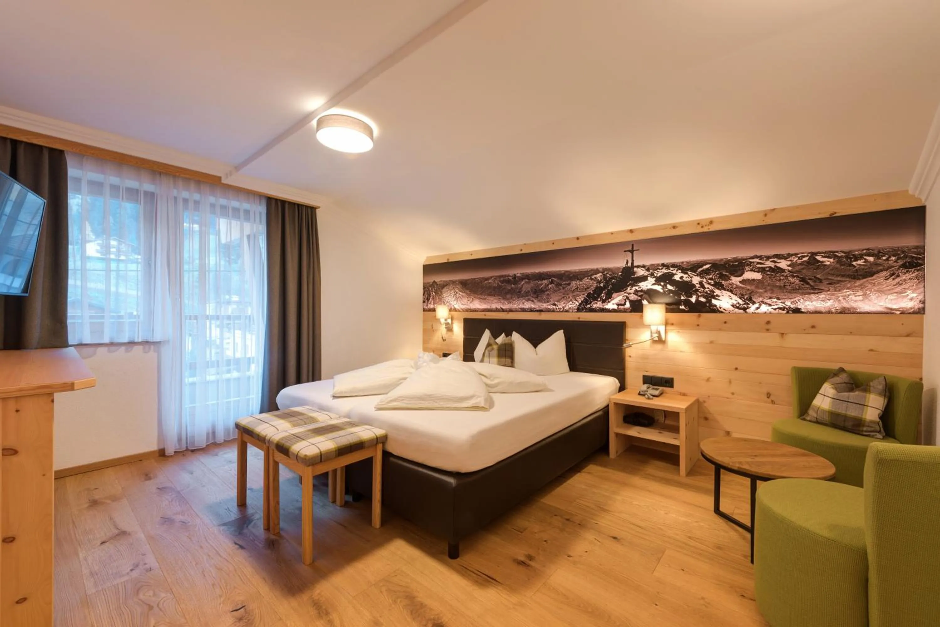 Photo of the whole room, Bed in Hotel Enzian Paznaun