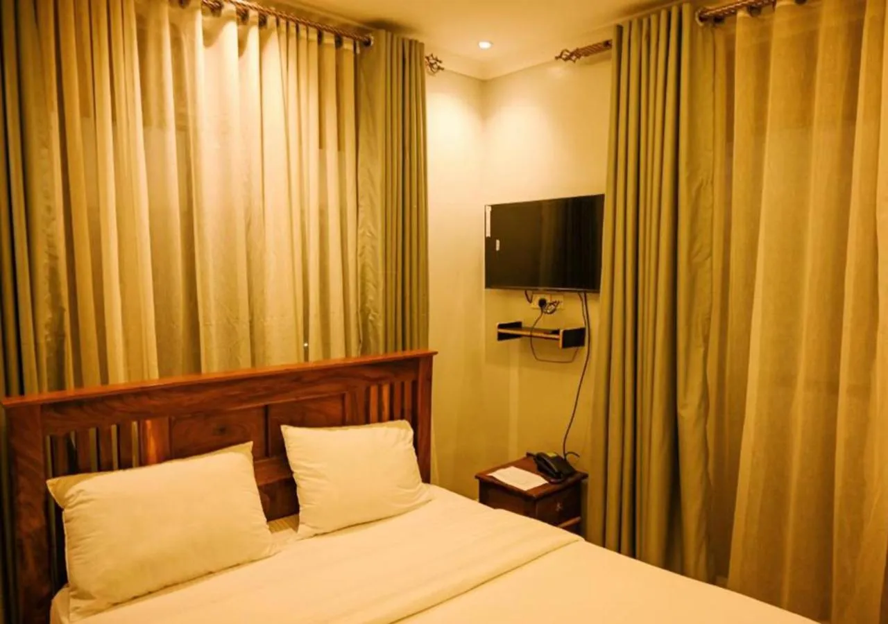 Bed in Neon Hotel Ntinda