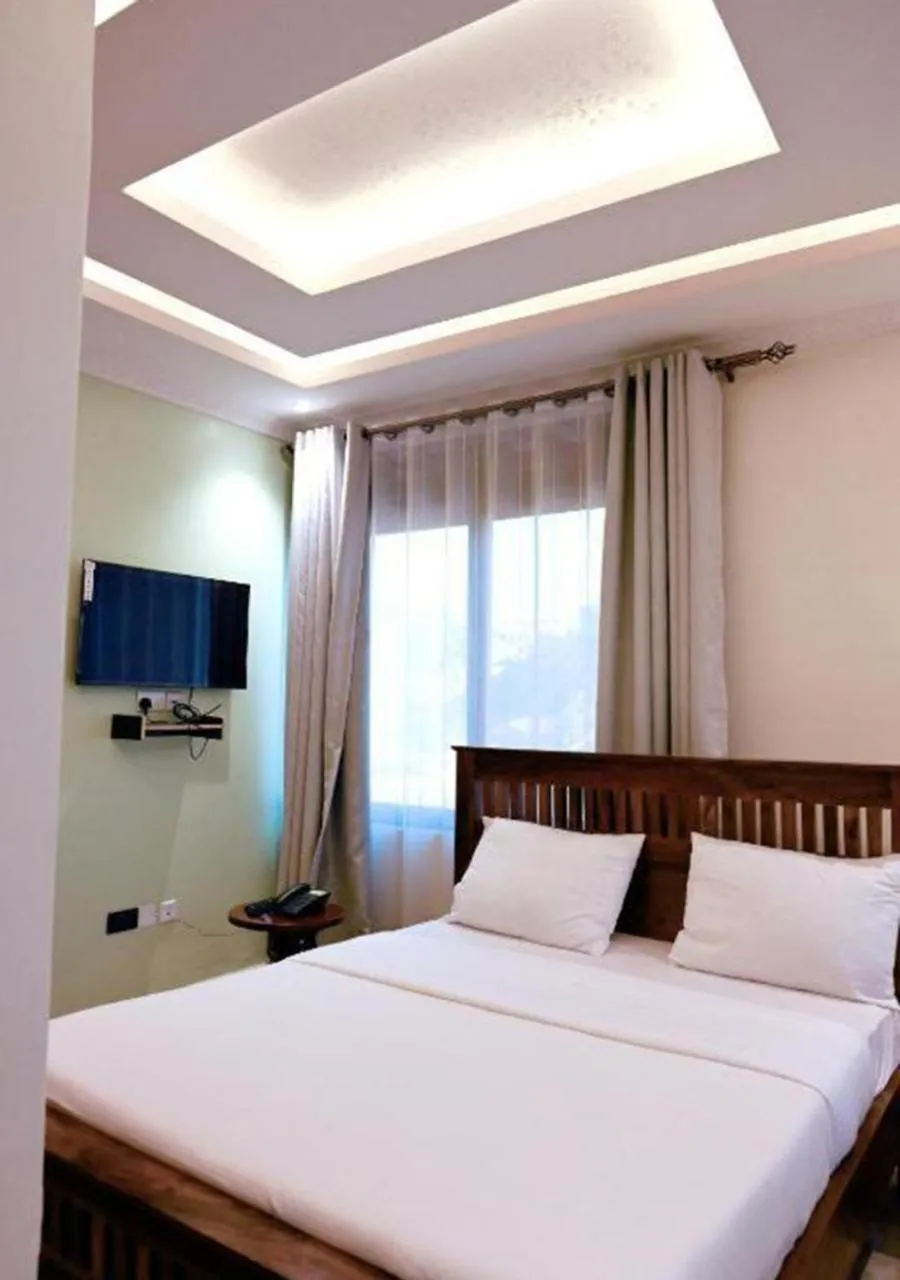 Bed in Neon Hotel Ntinda