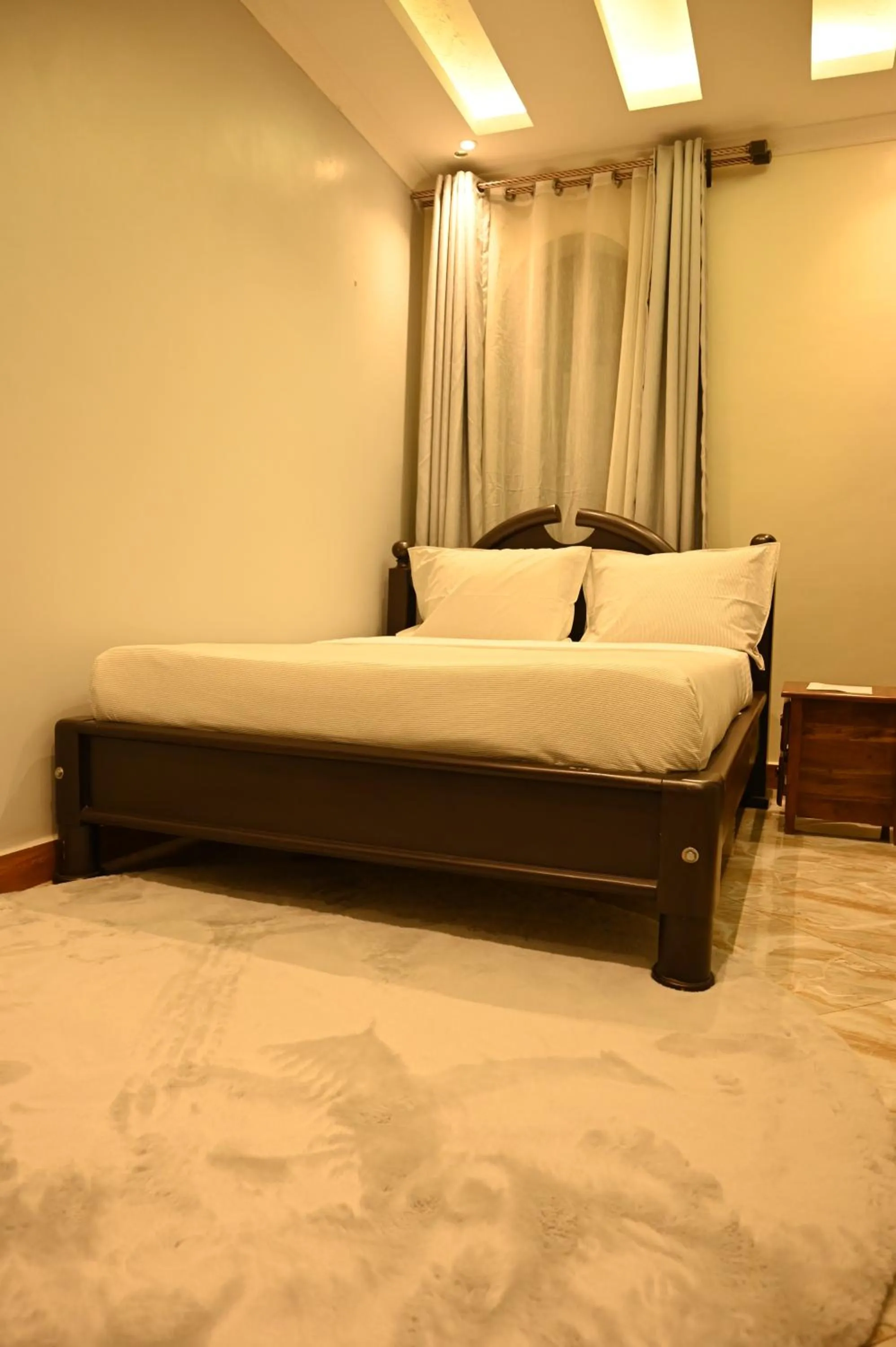 Bed in Neon Hotel Ntinda