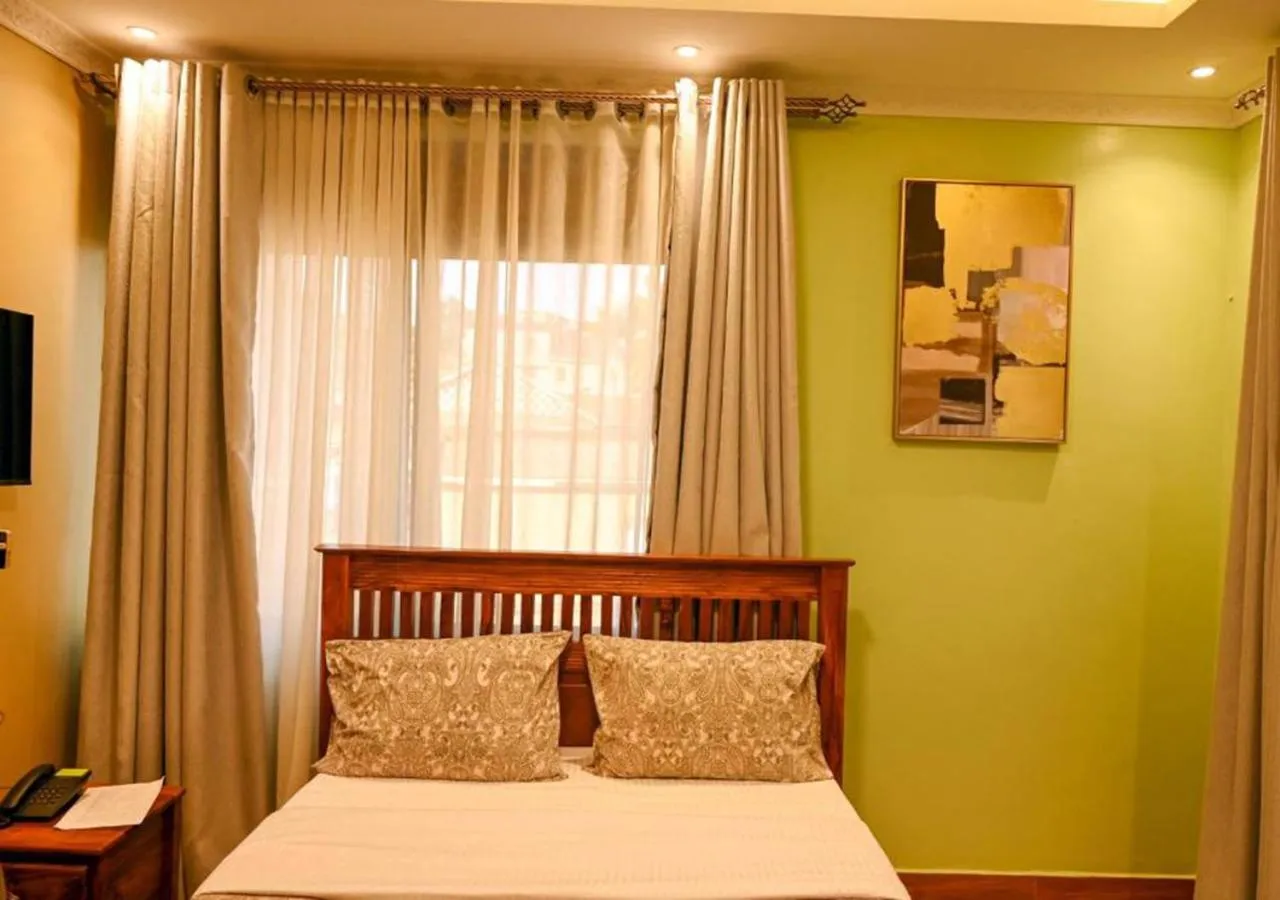 Bed in Neon Hotel Ntinda