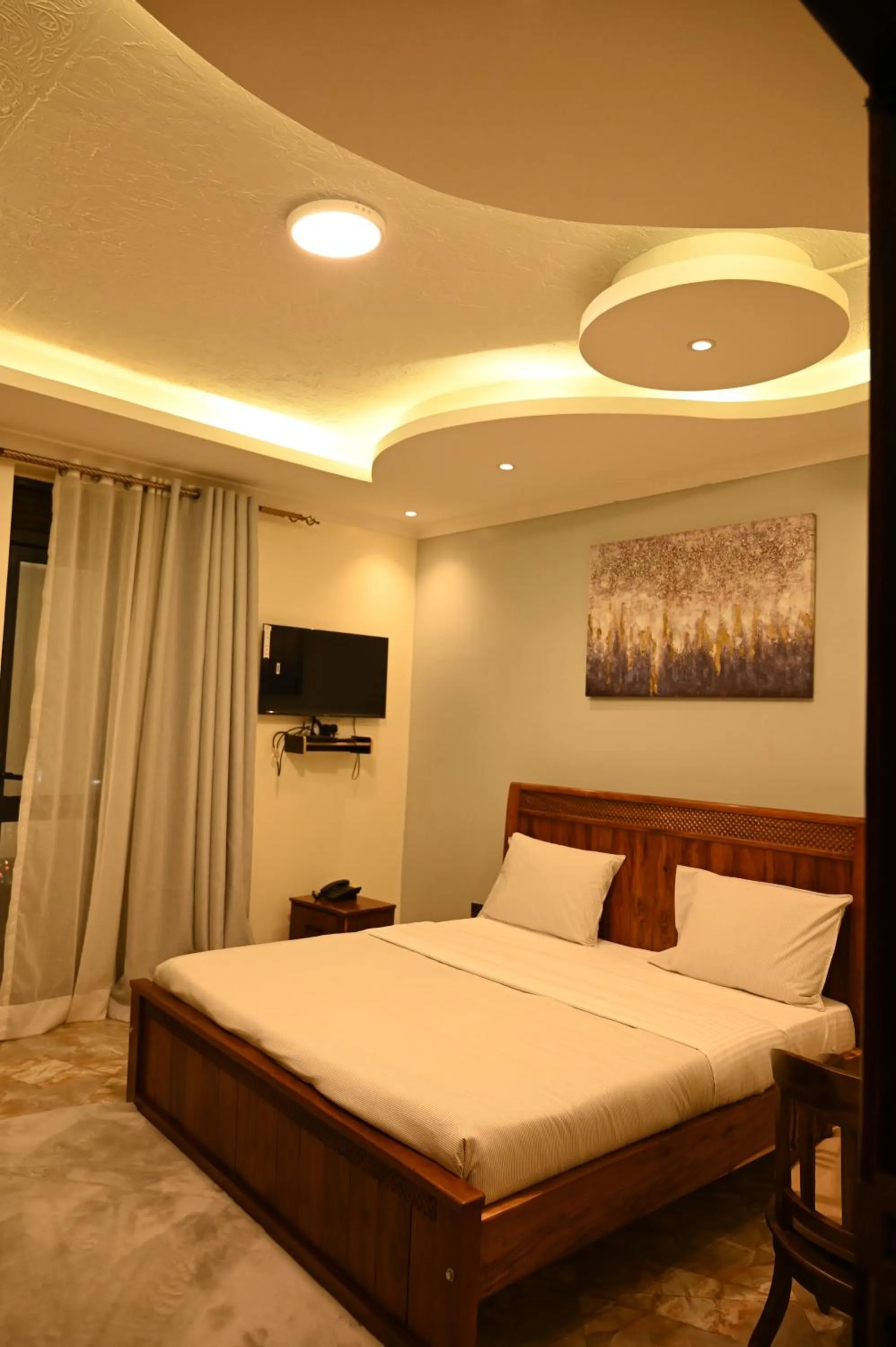 Bed in Neon Hotel Ntinda