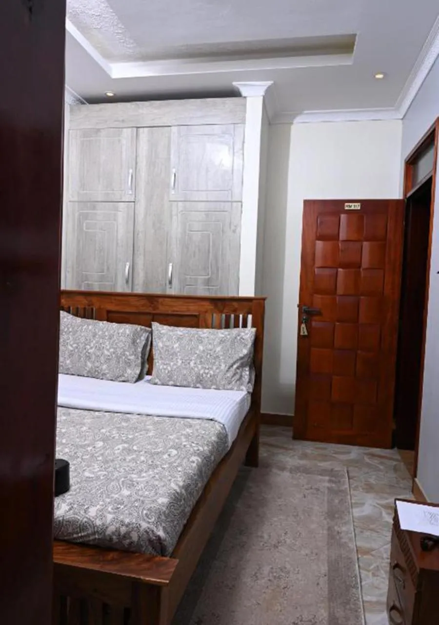 Bed in Neon Hotel Ntinda