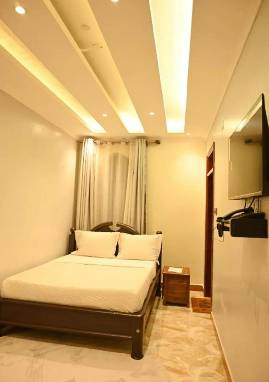 Bed in Neon Hotel Ntinda