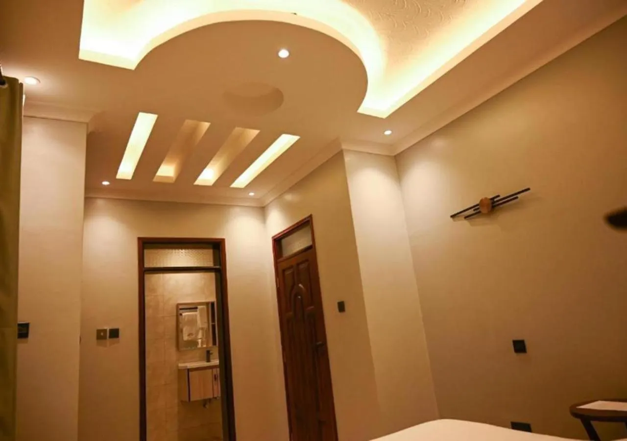 Bed in Neon Hotel Ntinda