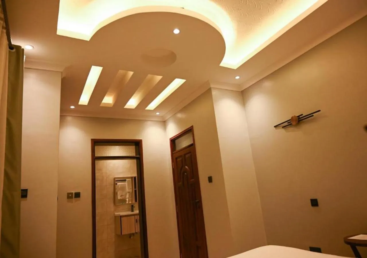 Bed in Neon Hotel Ntinda