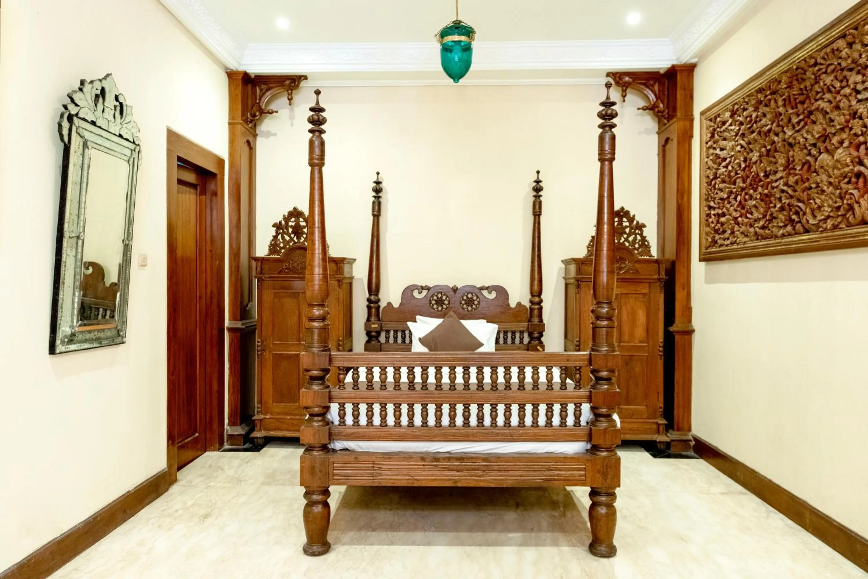 Bed in Rumah Pesik Art & Heritage Hotel