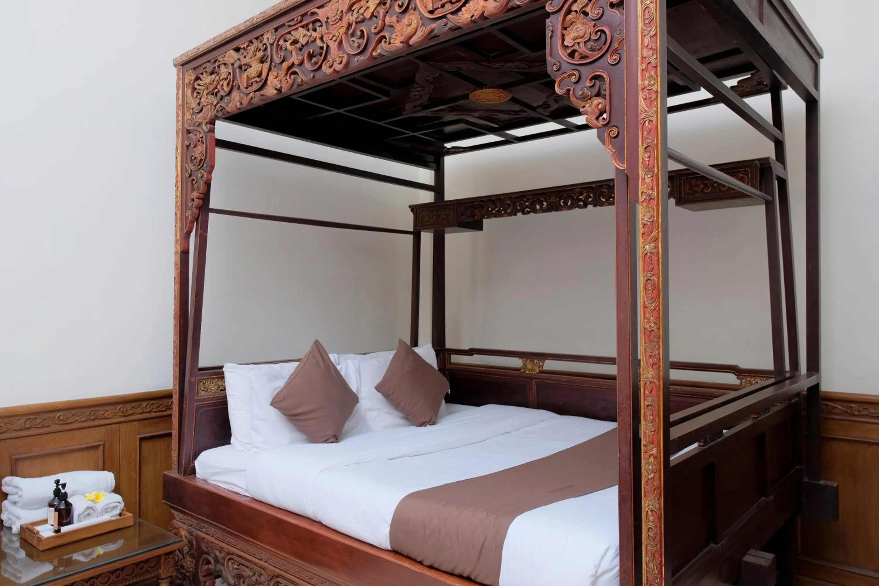 Bed in Rumah Pesik Art & Heritage Hotel