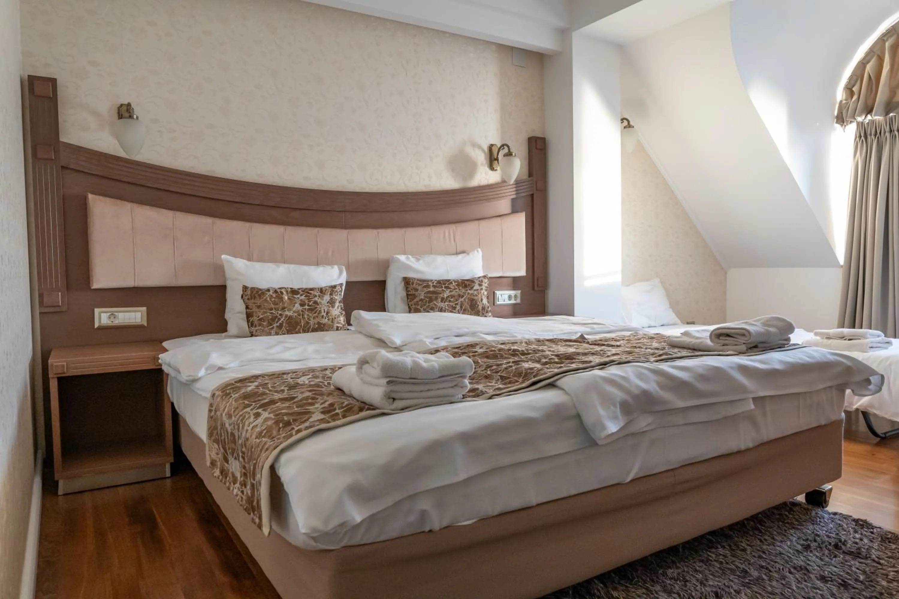 Bed in City Palace Hotel