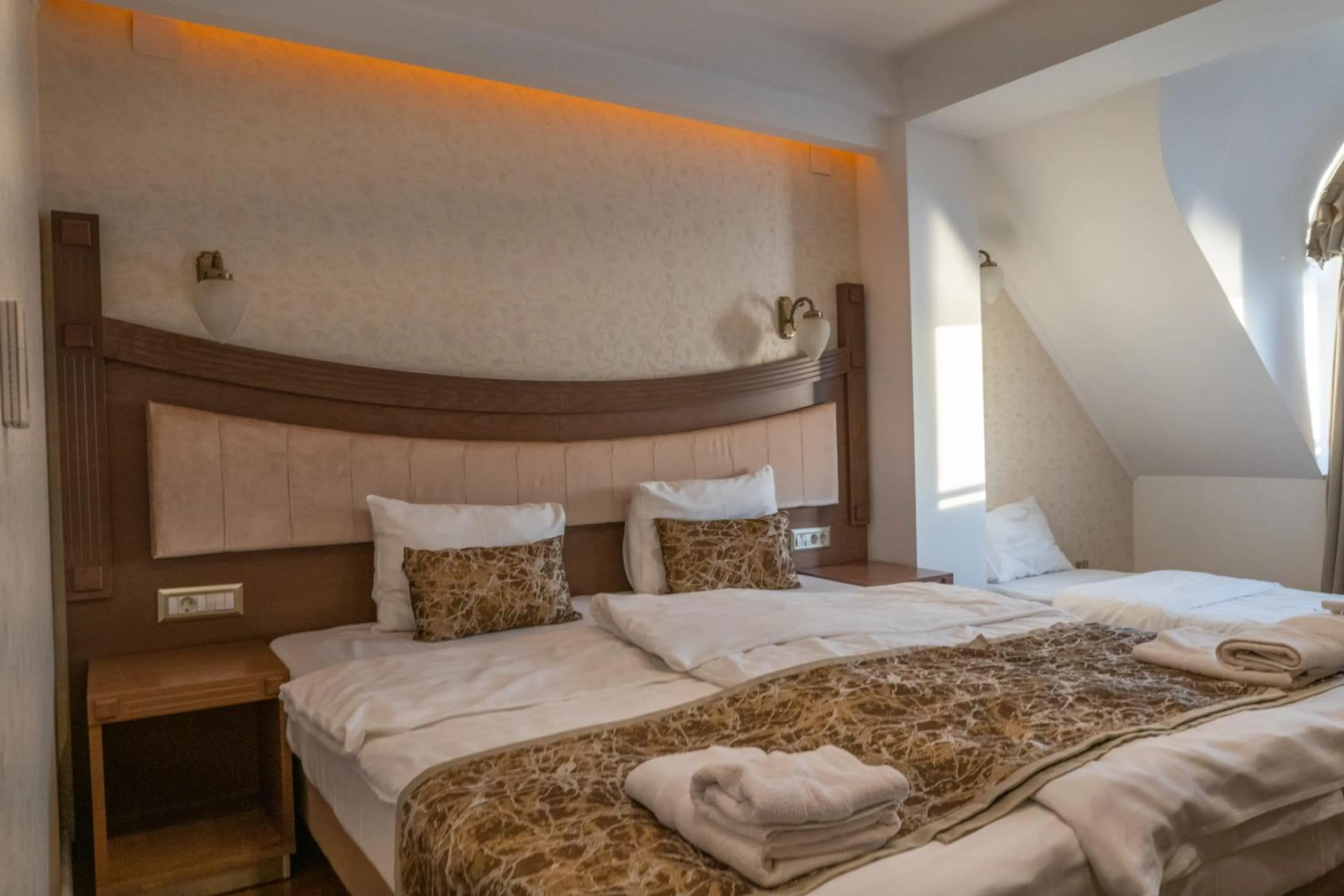 Bed in City Palace Hotel