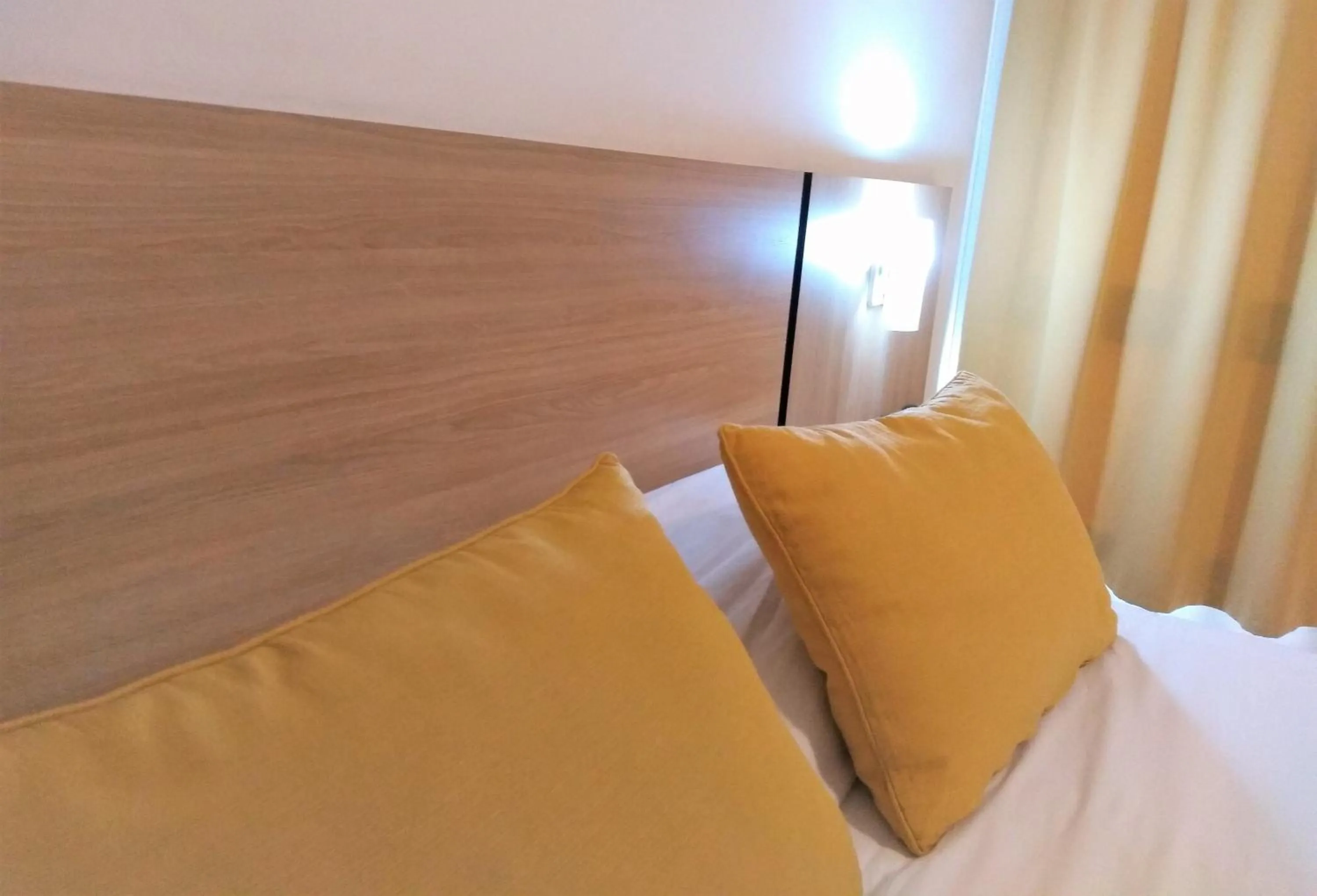 Bed in Apartamentos Mendoza Premium