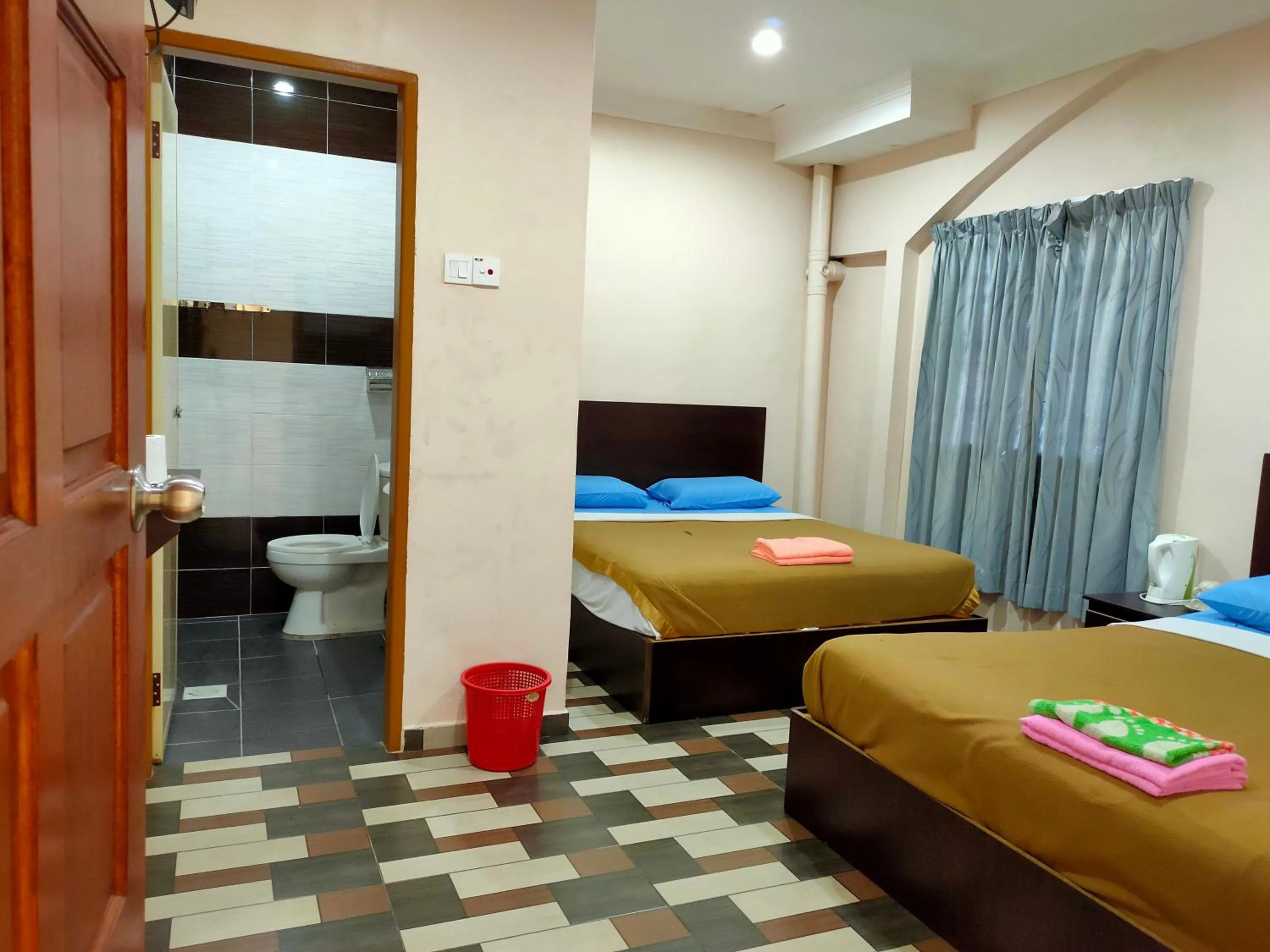 Bed in Ria Cameron Hotel