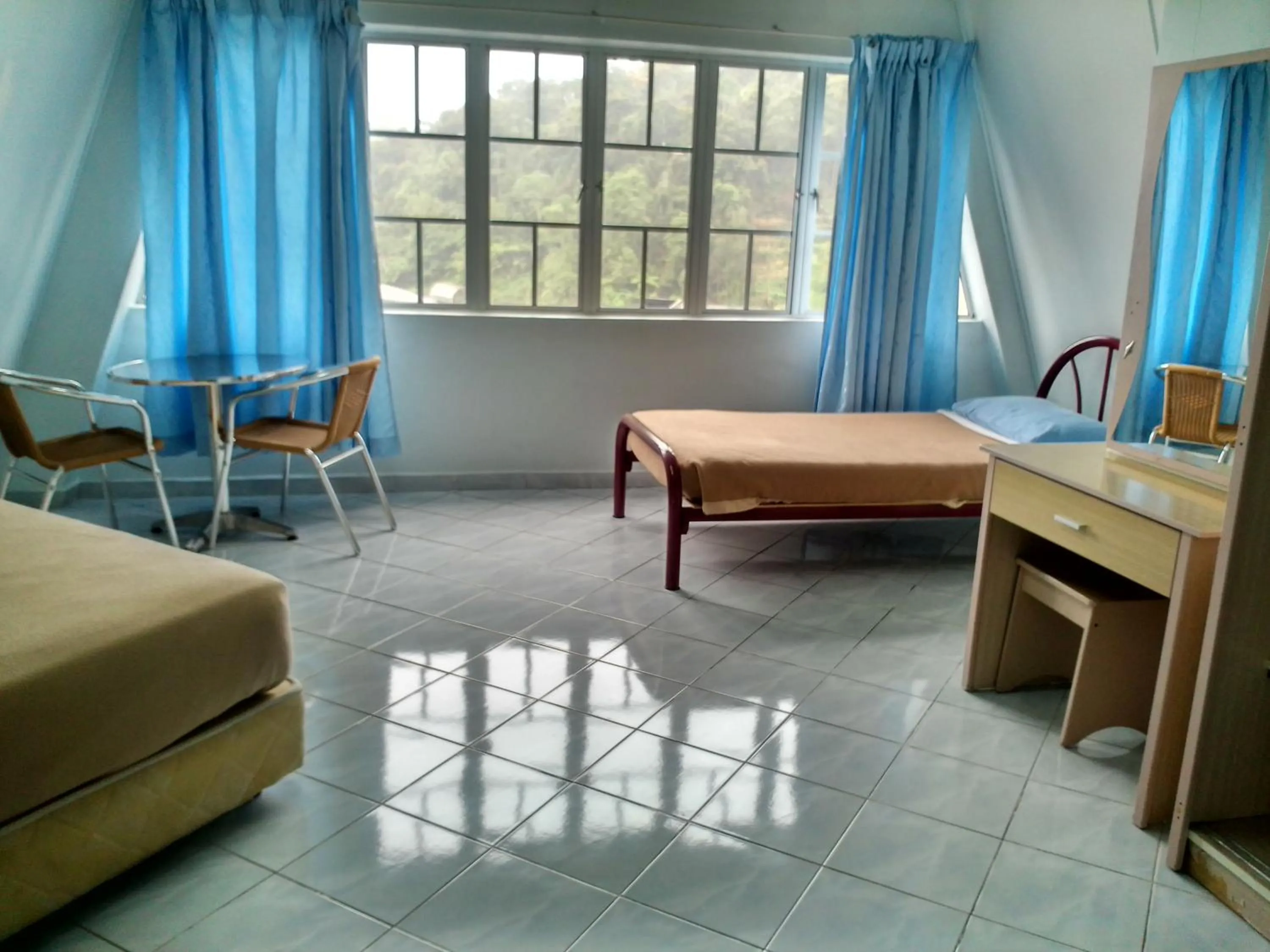 Bed in Ria Cameron Hotel