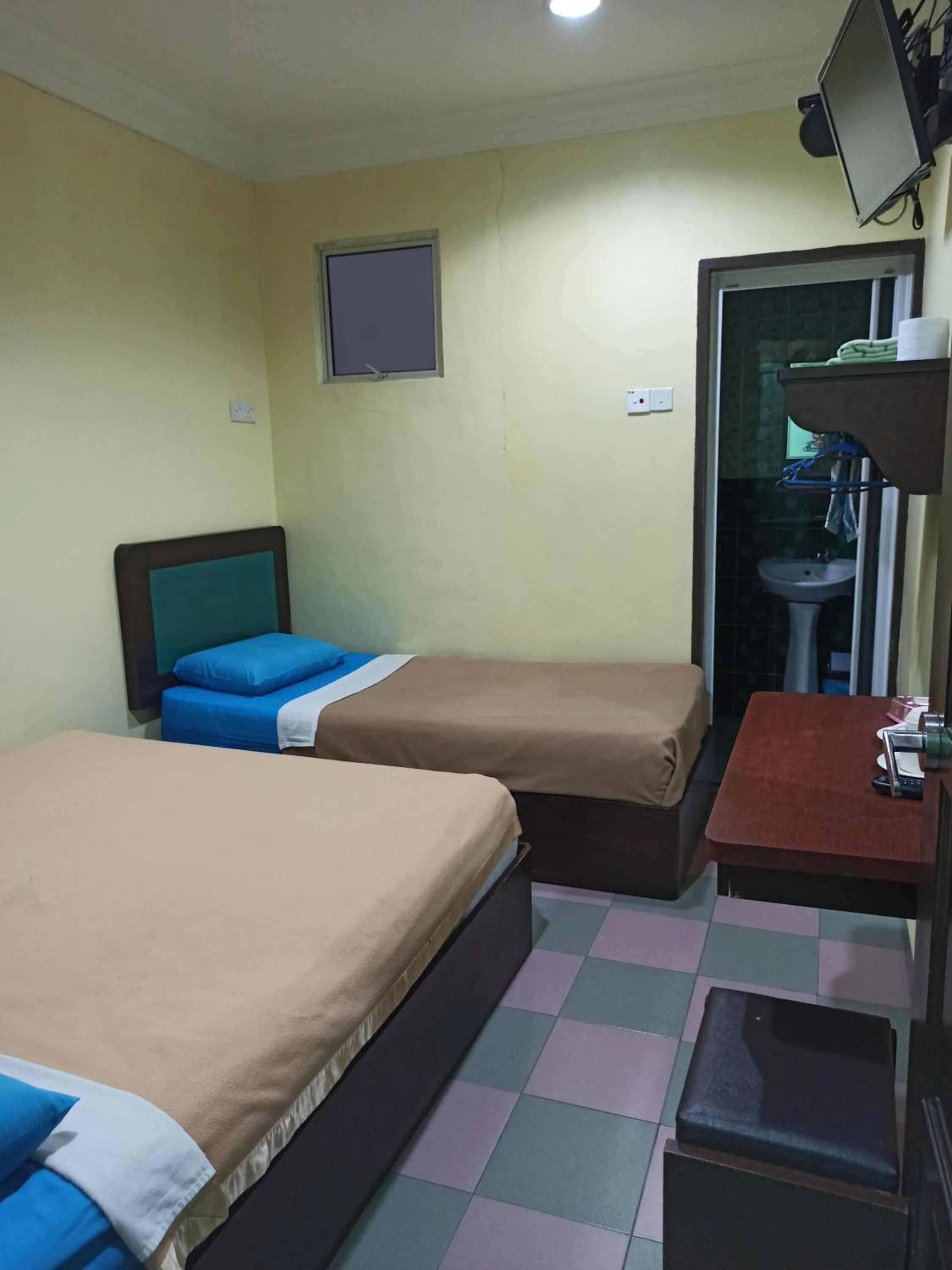 Bed in Ria Cameron Hotel