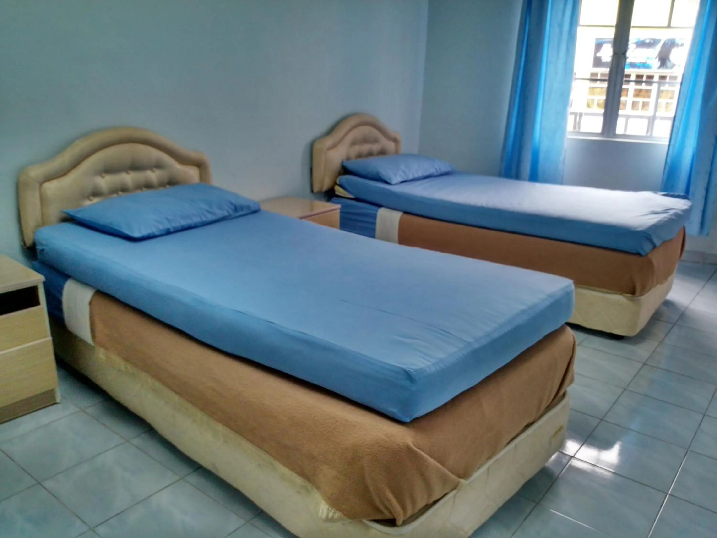 Bed in Ria Cameron Hotel