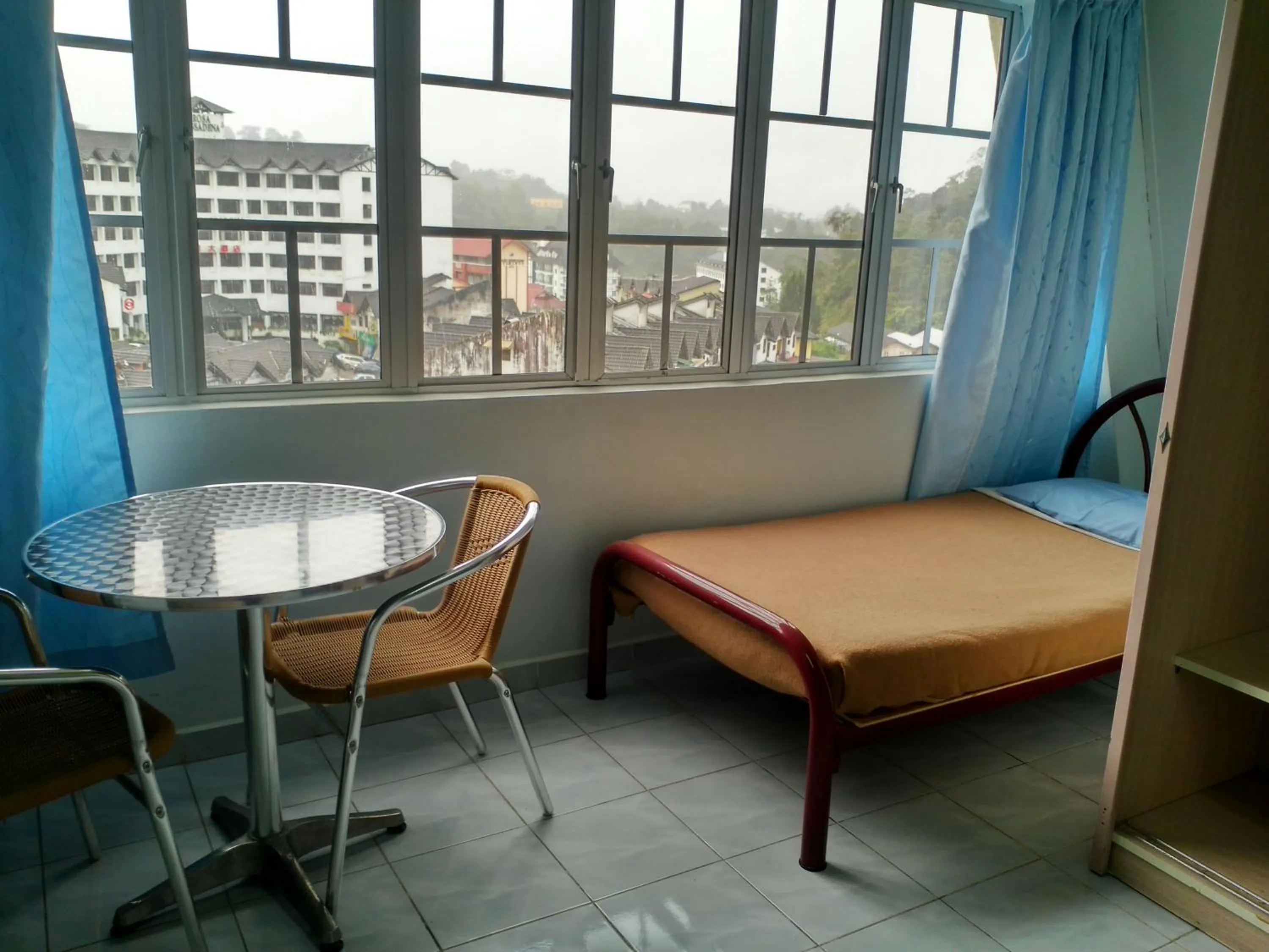 Bed in Ria Cameron Hotel