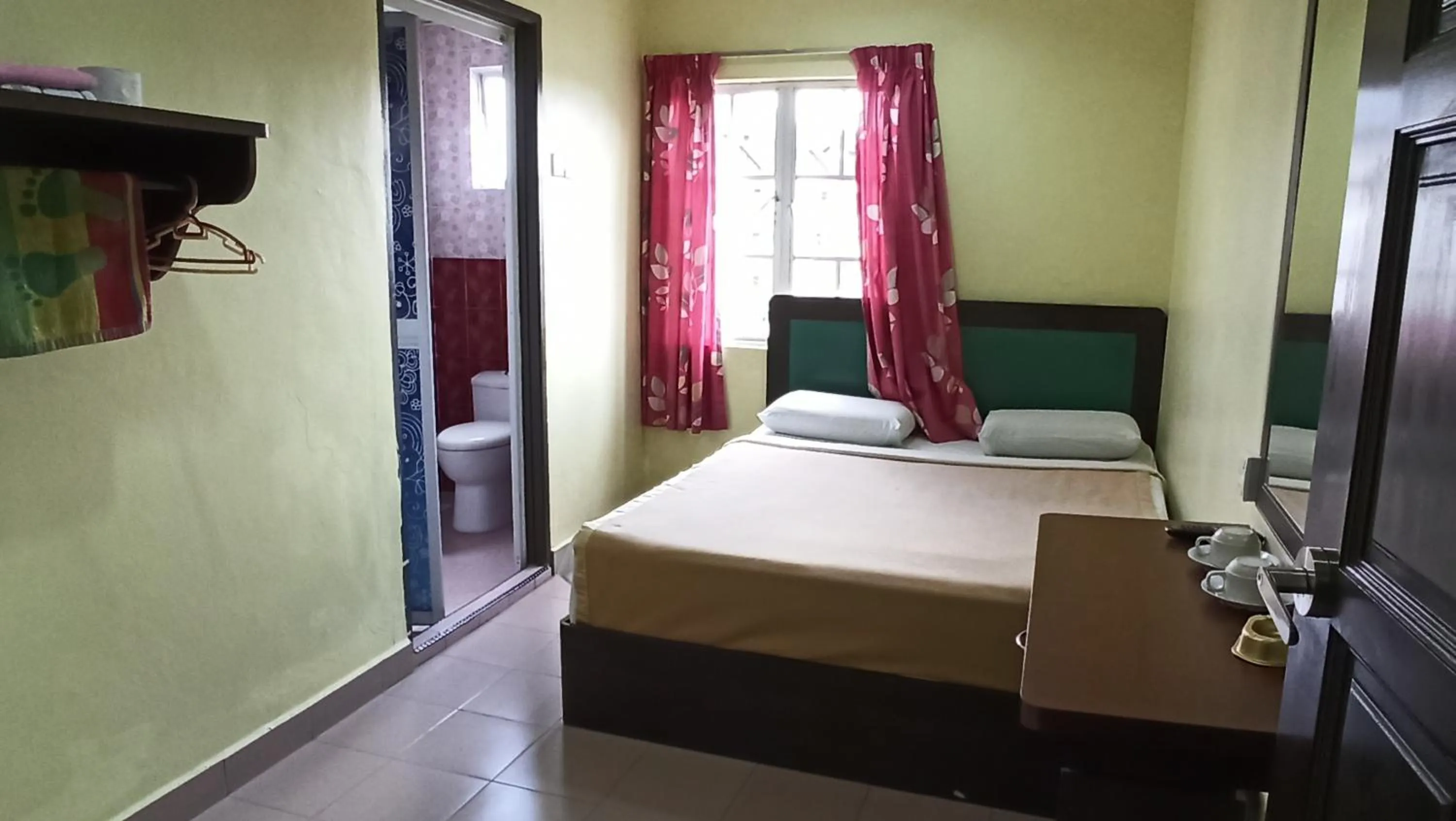 Bed in Ria Cameron Hotel