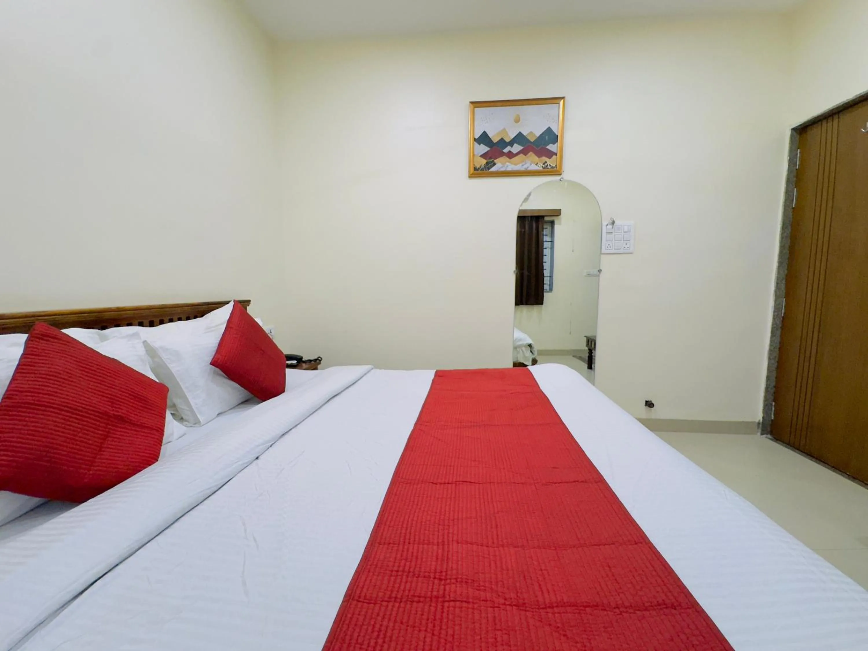 Photo of the whole room, Bed in Hotel Jyotirlinga- One Way Drop to Mahakal Temple